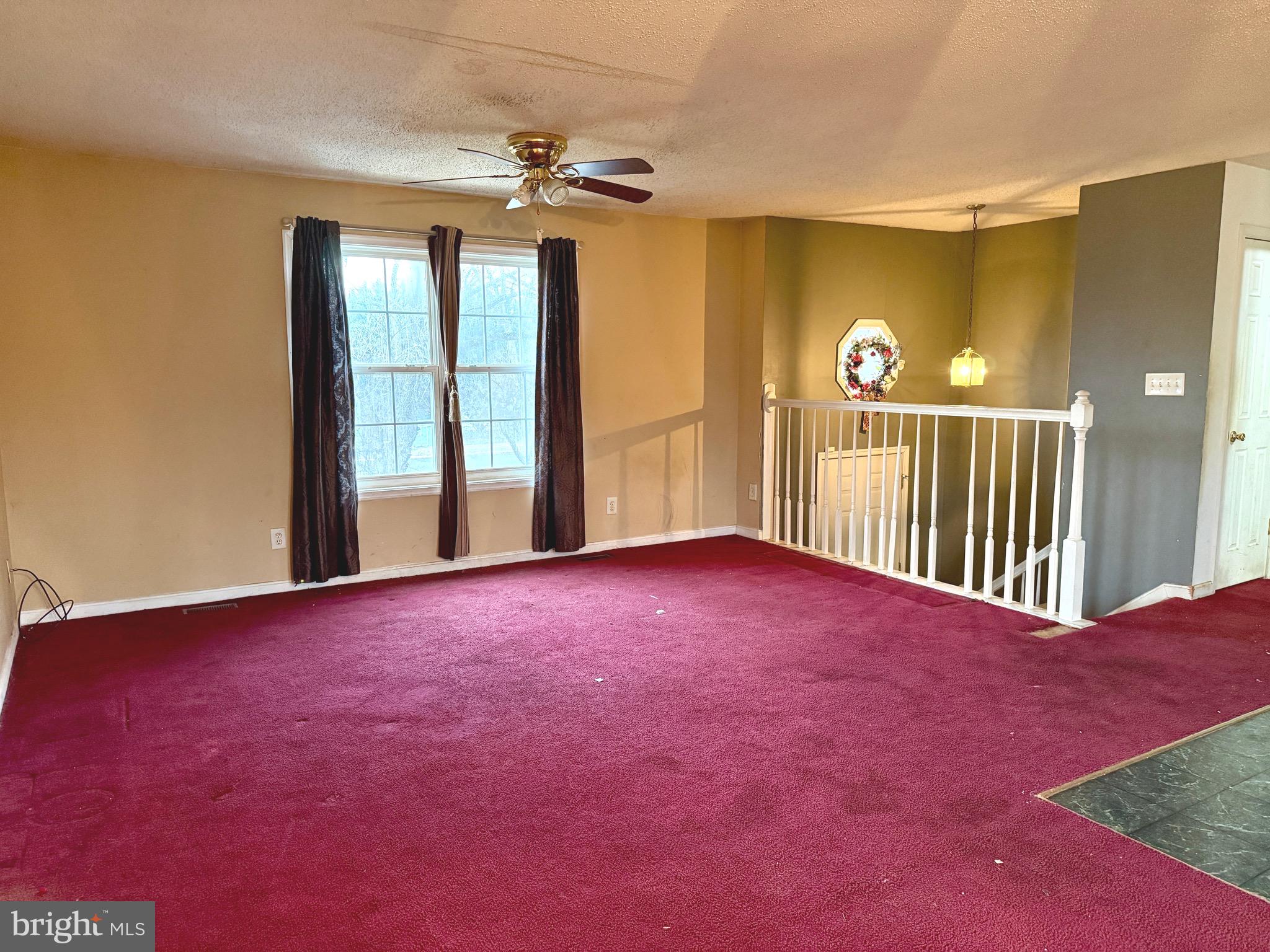 52 Morgan Street Inwood, WV 25428 - Photo 7 of 26 a view of an empty room with a window