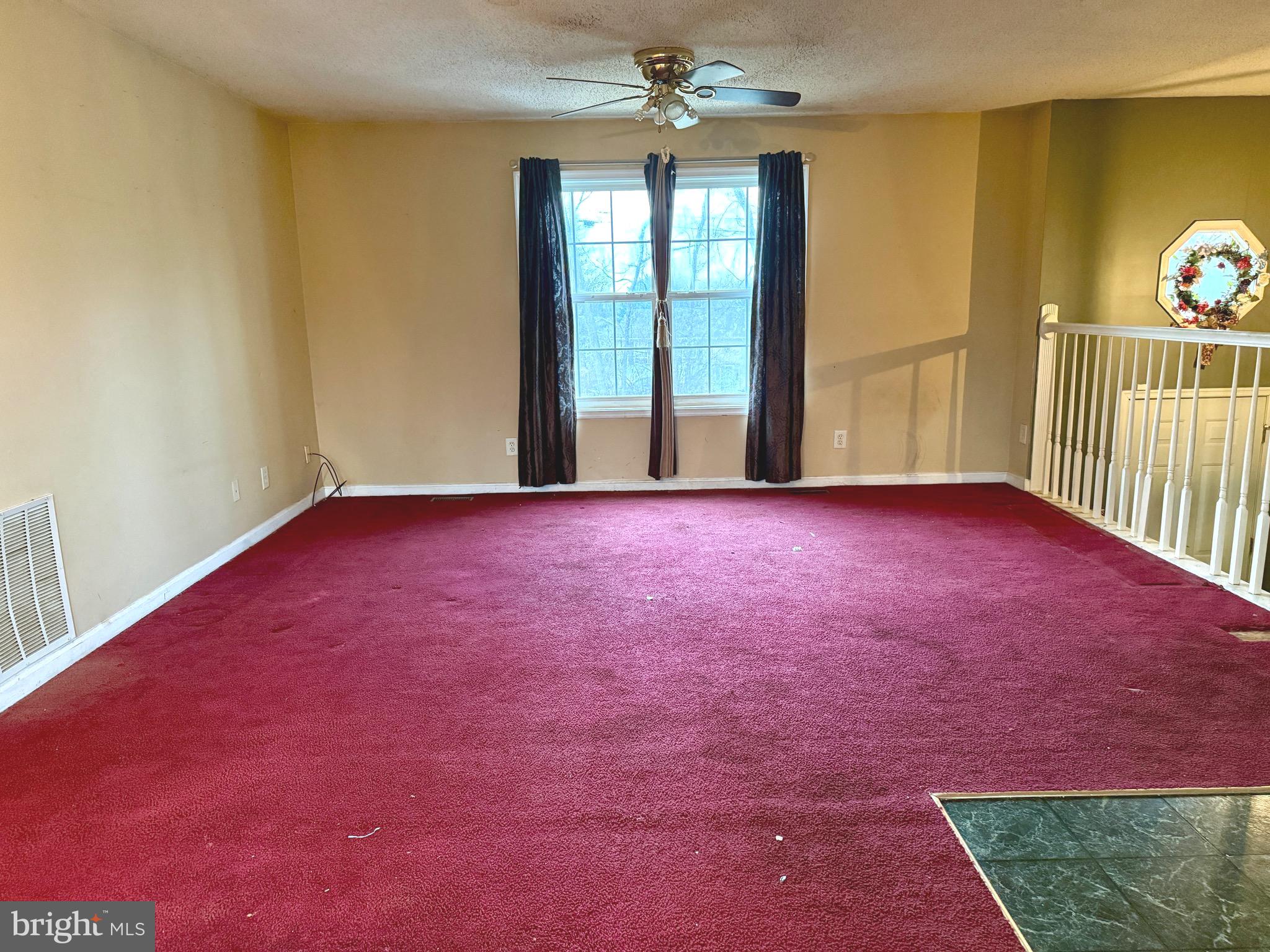 52 Morgan Street Inwood, WV 25428 - Photo 8 of 26 a view of empty room with floor to ceiling window
