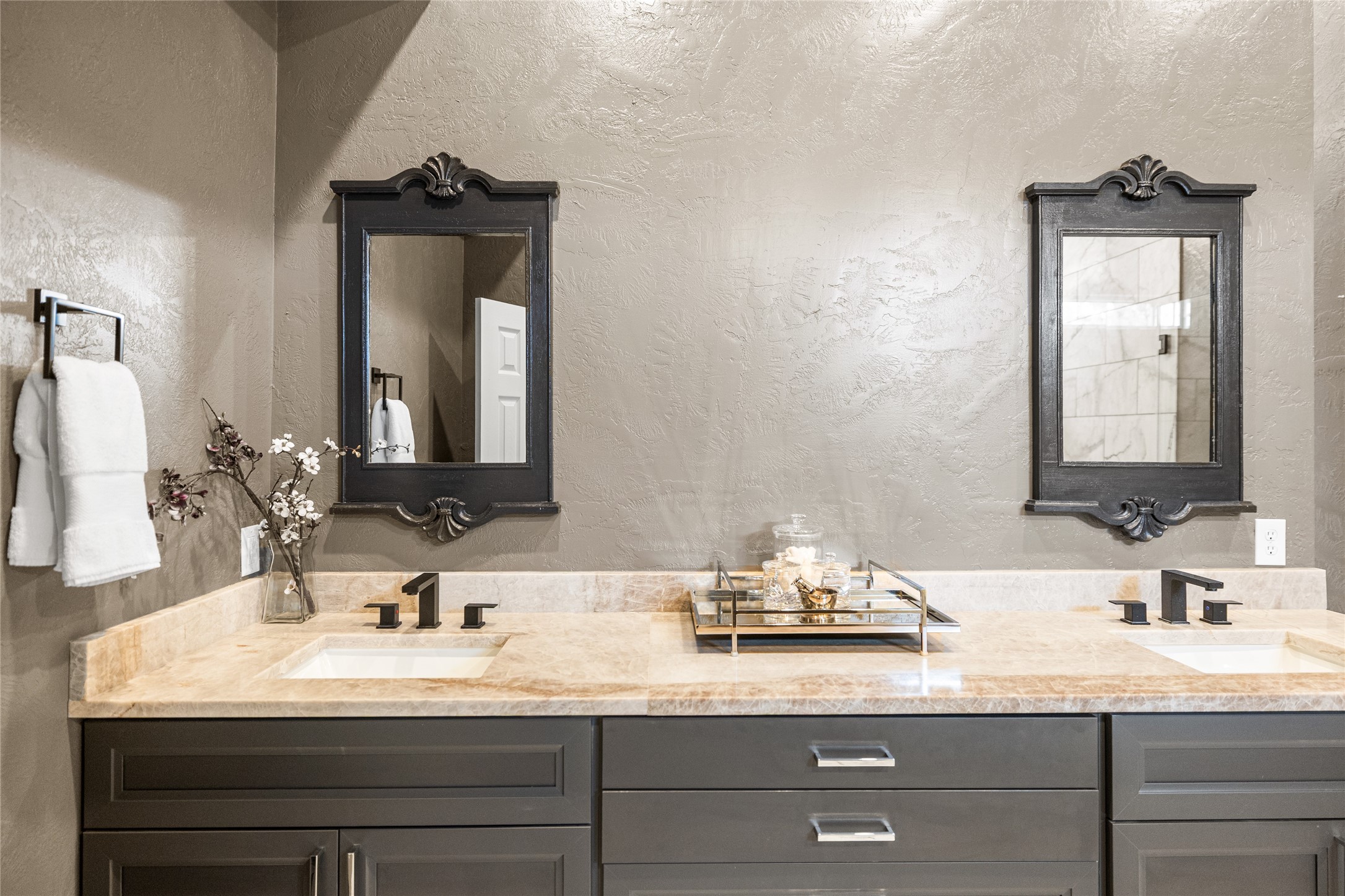 495 Everitt Road Cleveland, TX 77328 - Photo 25 of 43 a bathroom with double vanity sinks and a mirror