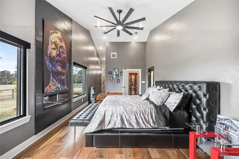 a bed sitting in a bedroom next to a window