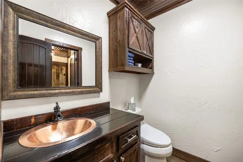 a bathroom with a sink and a window