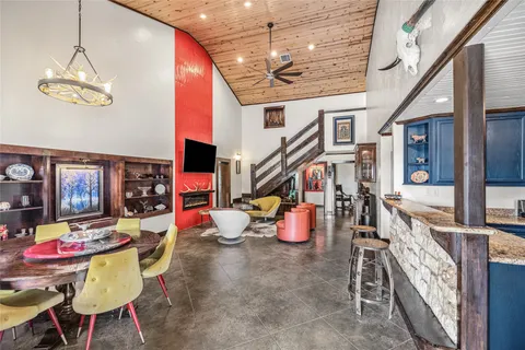 a very nice looking dining room with a table and chairs