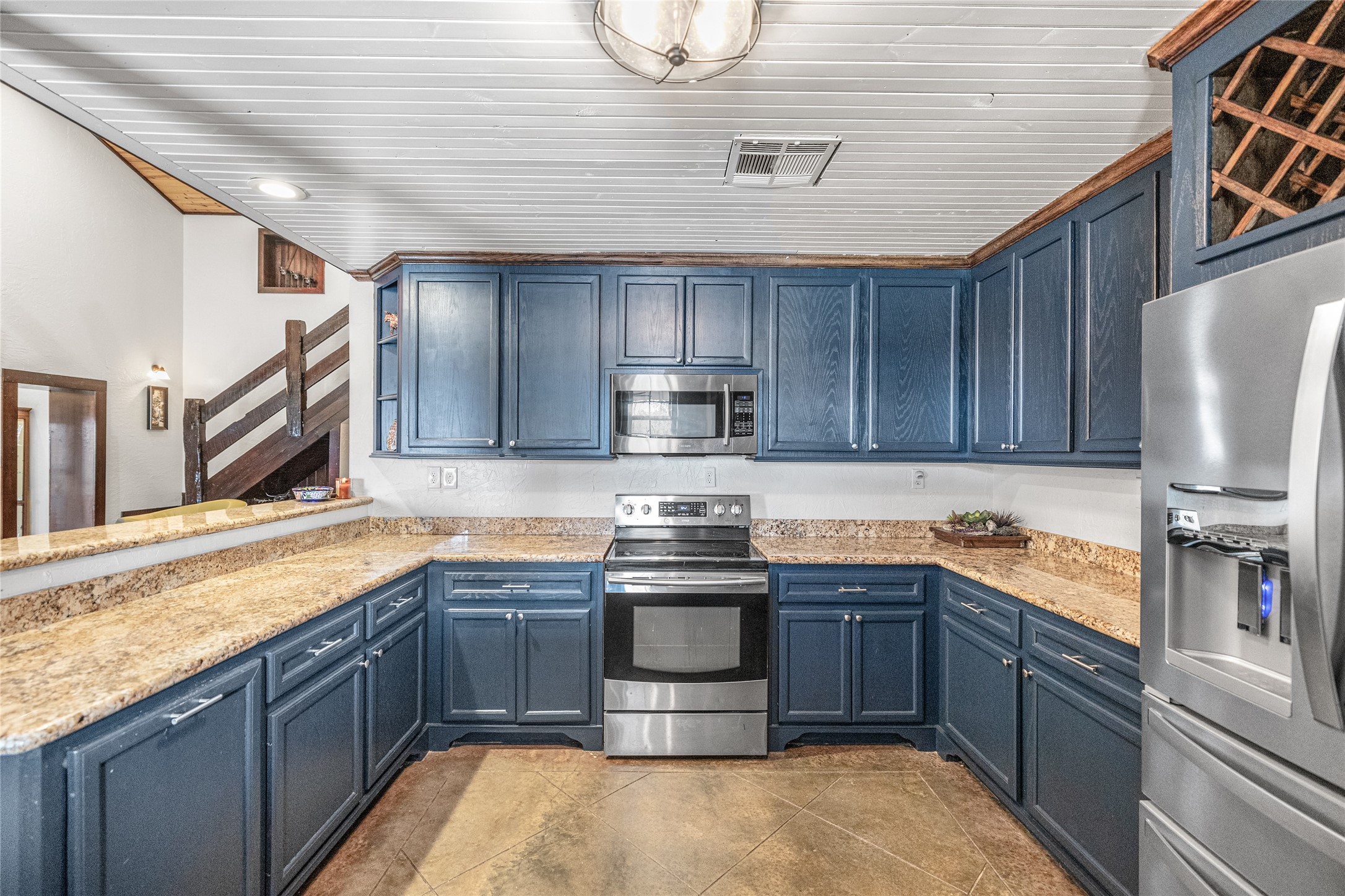 495 Everitt Road Cleveland, TX 77328 - Photo 8 of 43 a kitchen with stainless steel appliances granite countertop a sink stove and refrigerator