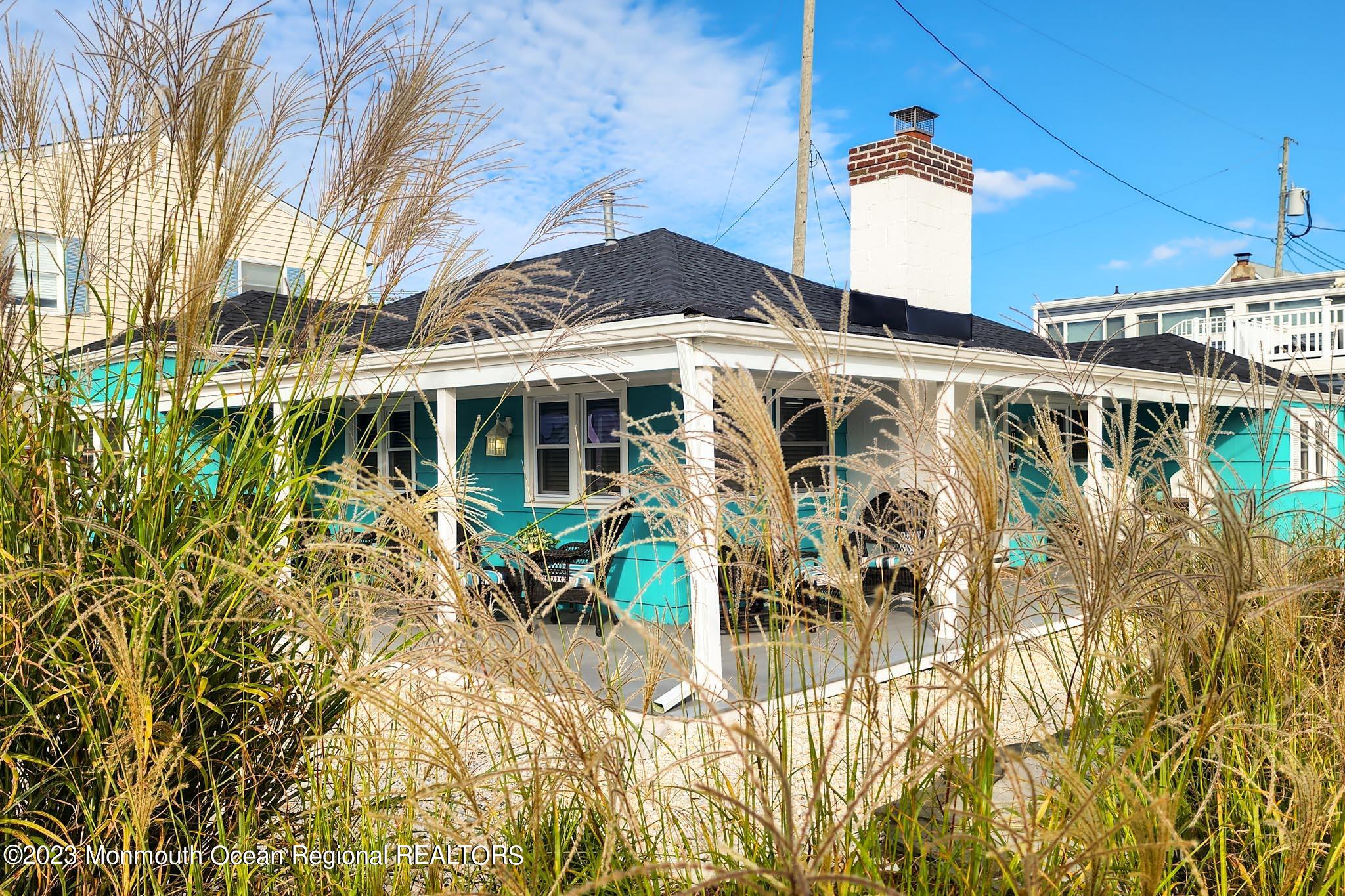 54 Silver Beach Road Lavallette, NJ 08735 - Photo 13 of 49 a view of a chairs and table in patio