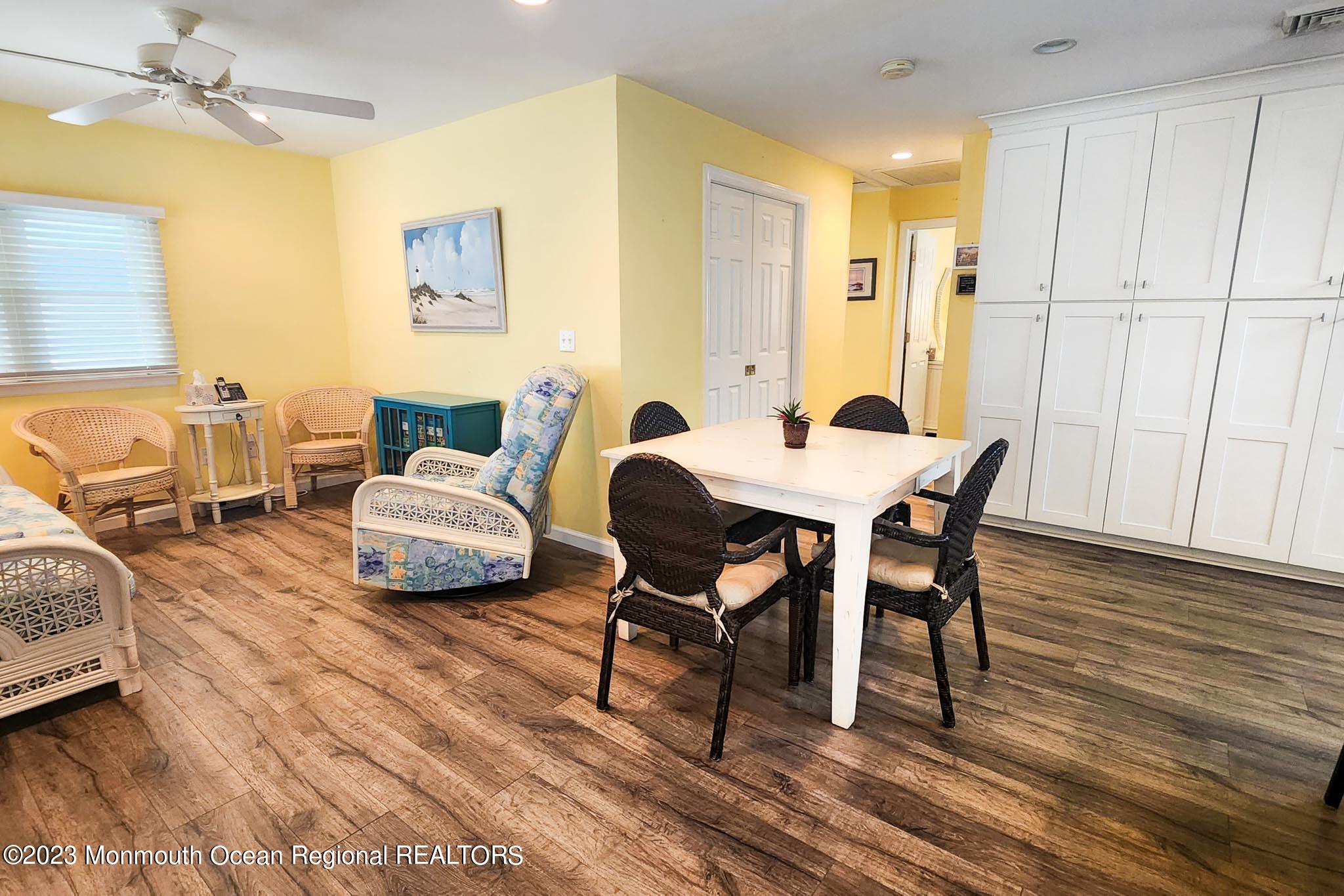 54 Silver Beach Road Lavallette, NJ 08735 - Photo 16 of 49 a living room with furniture and a wooden floor