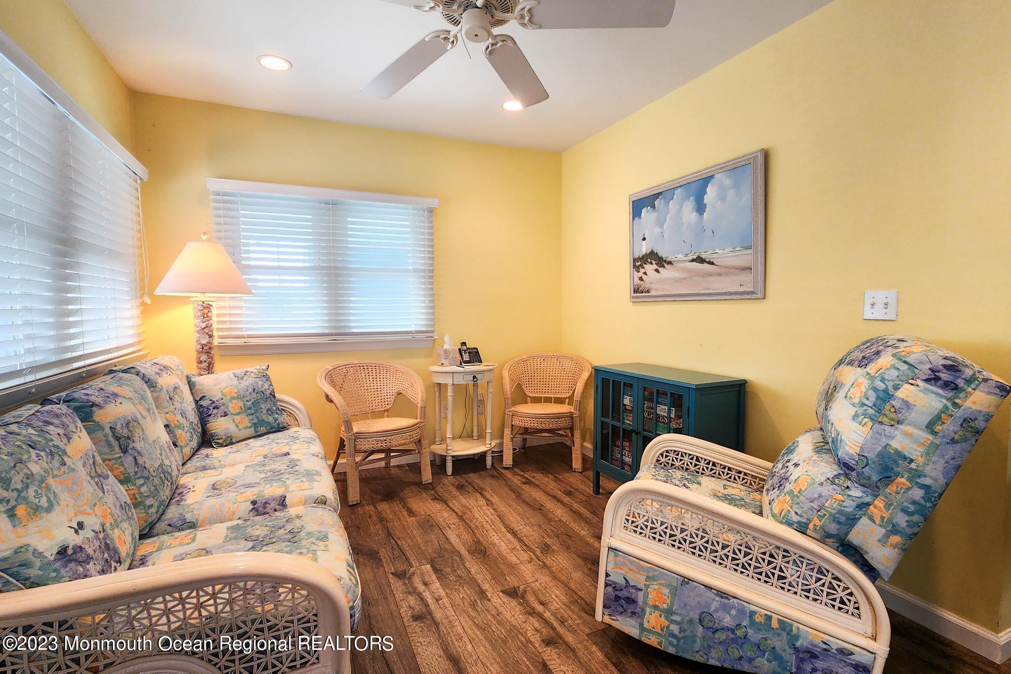 54 Silver Beach Road Lavallette, NJ 08735 - Photo 18 of 49 a living room with furniture and a wooden floor