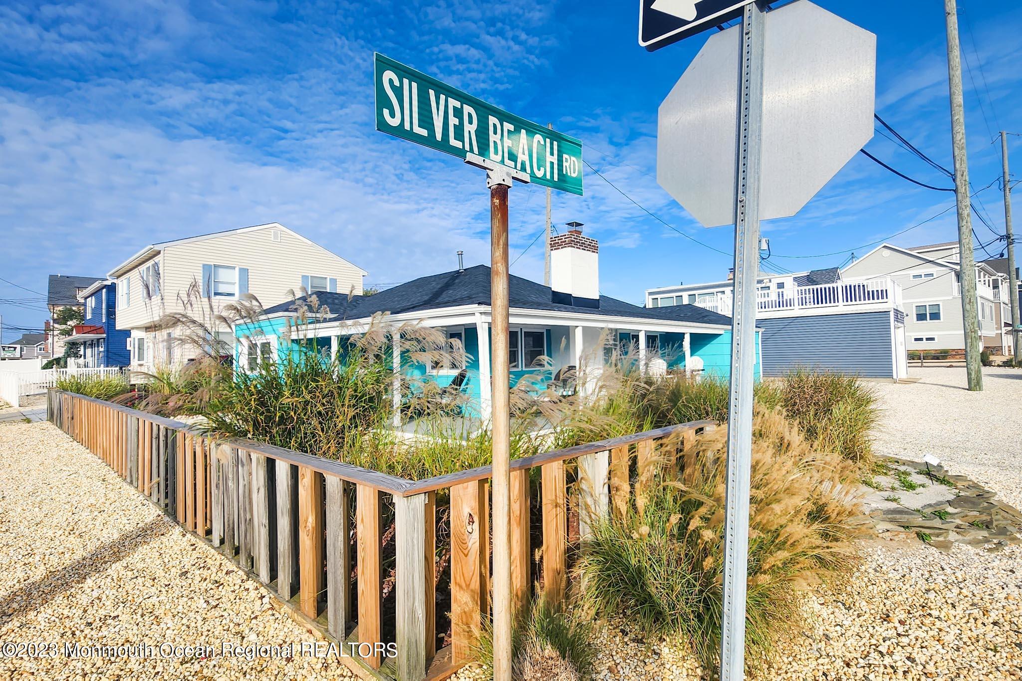 54 Silver Beach Road Lavallette, NJ 08735 - Photo 2 of 49 a front view of a house with wooden stairs