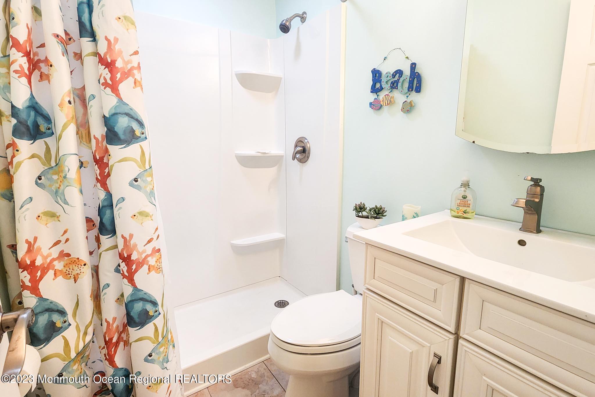 54 Silver Beach Road Lavallette, NJ 08735 - Photo 27 of 49 a bathroom with a sink toilet and shower