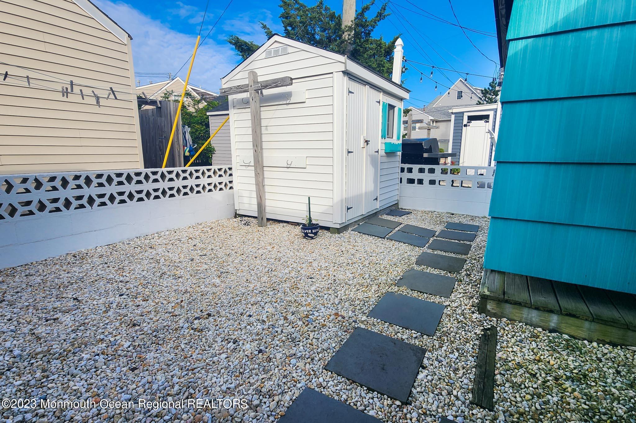 54 Silver Beach Road Lavallette, NJ 08735 - Photo 36 of 49 a view of a house with a yard