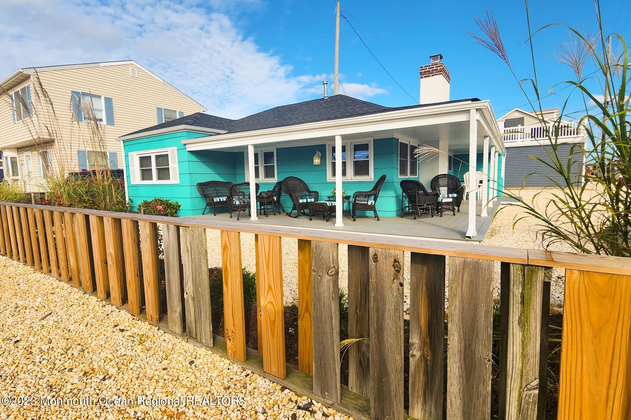 54 Silver Beach Road Lavallette, NJ 08735 - Photo 9 of 49 a view of a house with a small yard