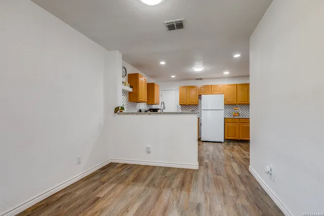 a view of a kitchen with a sink and a microwave