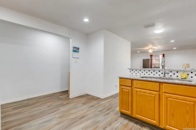a view of kitchen with wooden floor