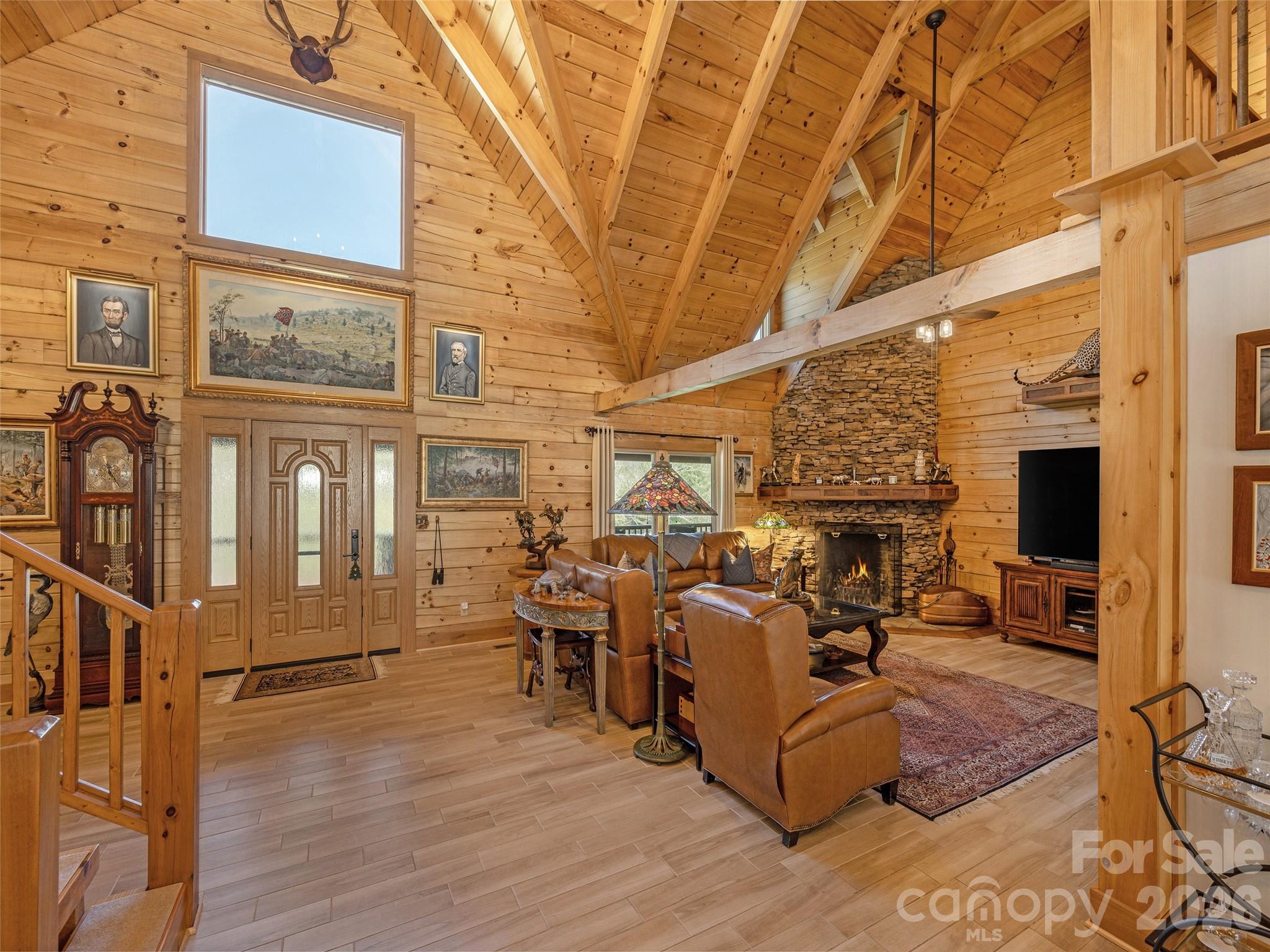 622 Oleta Road Hendersonville, NC 28792 - Photo 11 of 48 a living room with furniture a fireplace and wooden floor