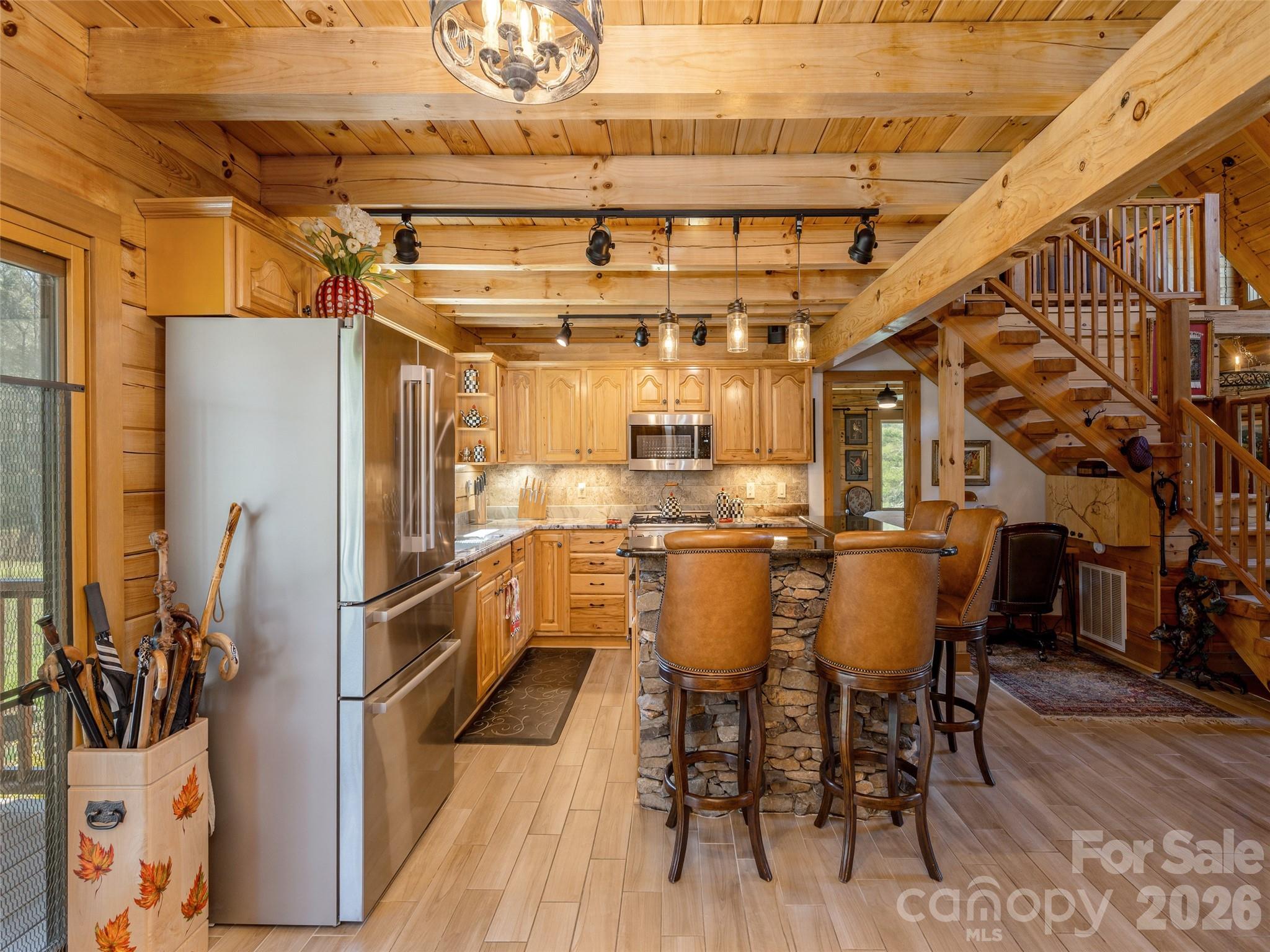 622 Oleta Road Hendersonville, NC 28792 - Photo 16 of 48 a dining room with furniture and wooden floor