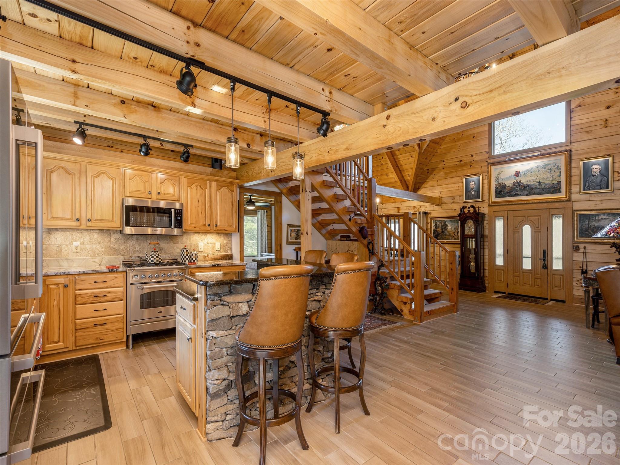 622 Oleta Road Hendersonville, NC 28792 - Photo 17 of 48 a view of a dining room with furniture window and wooden floor