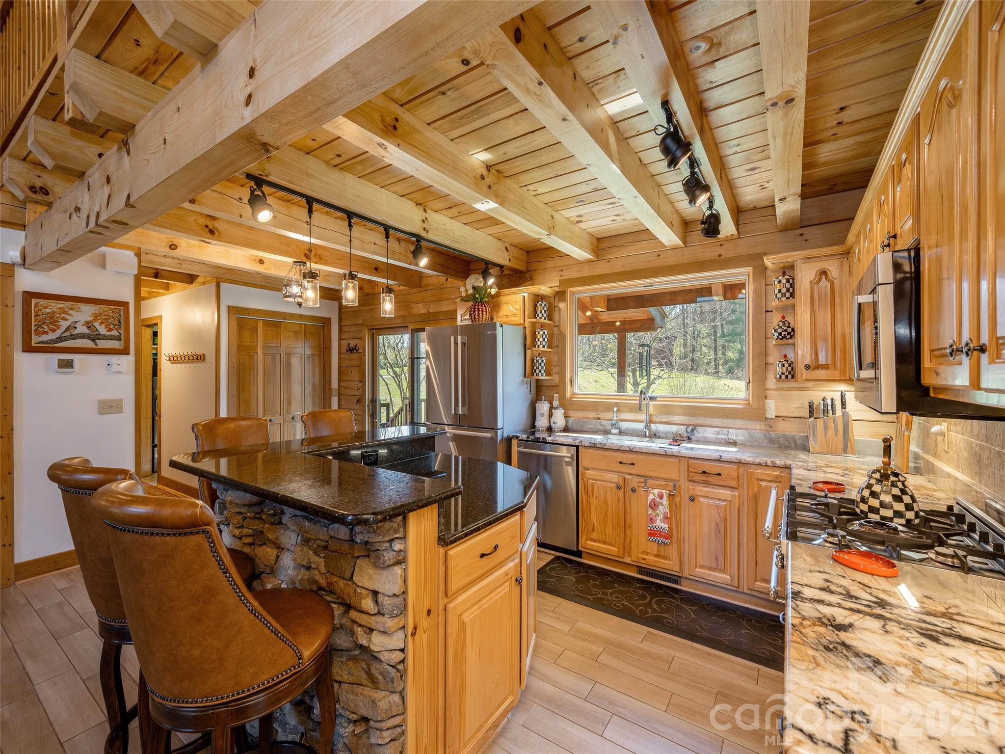 622 Oleta Road Hendersonville, NC 28792 - Photo 19 of 48 a dining hall with stainless steel appliances granite countertop a sink and cabinets