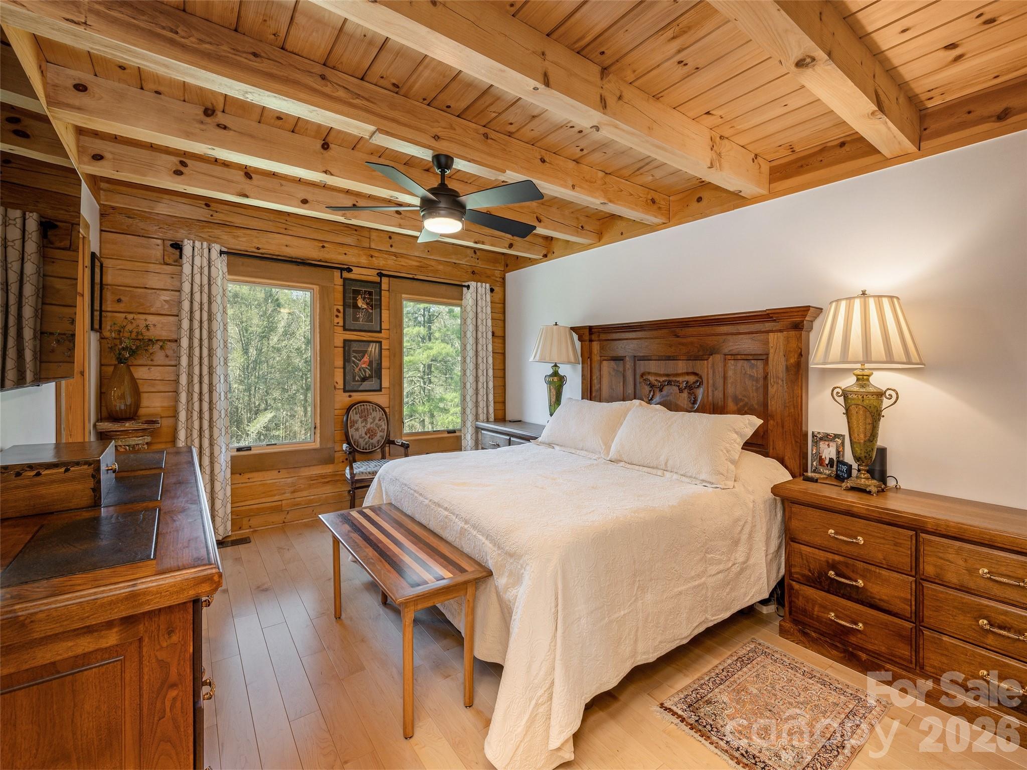622 Oleta Road Hendersonville, NC 28792 - Photo 21 of 48 a bed sitting in a bedroom next to a window