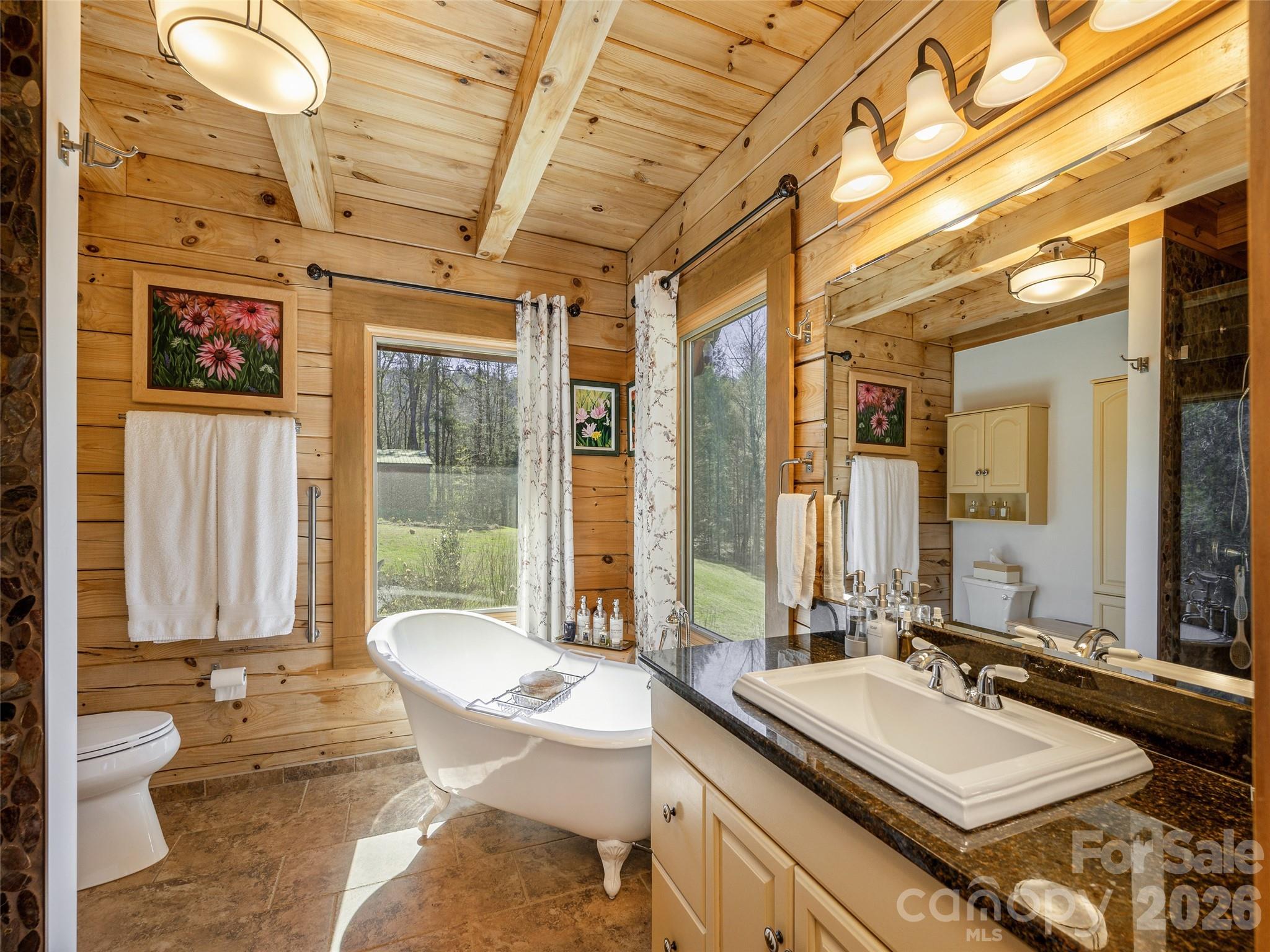 622 Oleta Road Hendersonville, NC 28792 - Photo 24 of 48 a bathroom with a granite countertop sink and a mirror