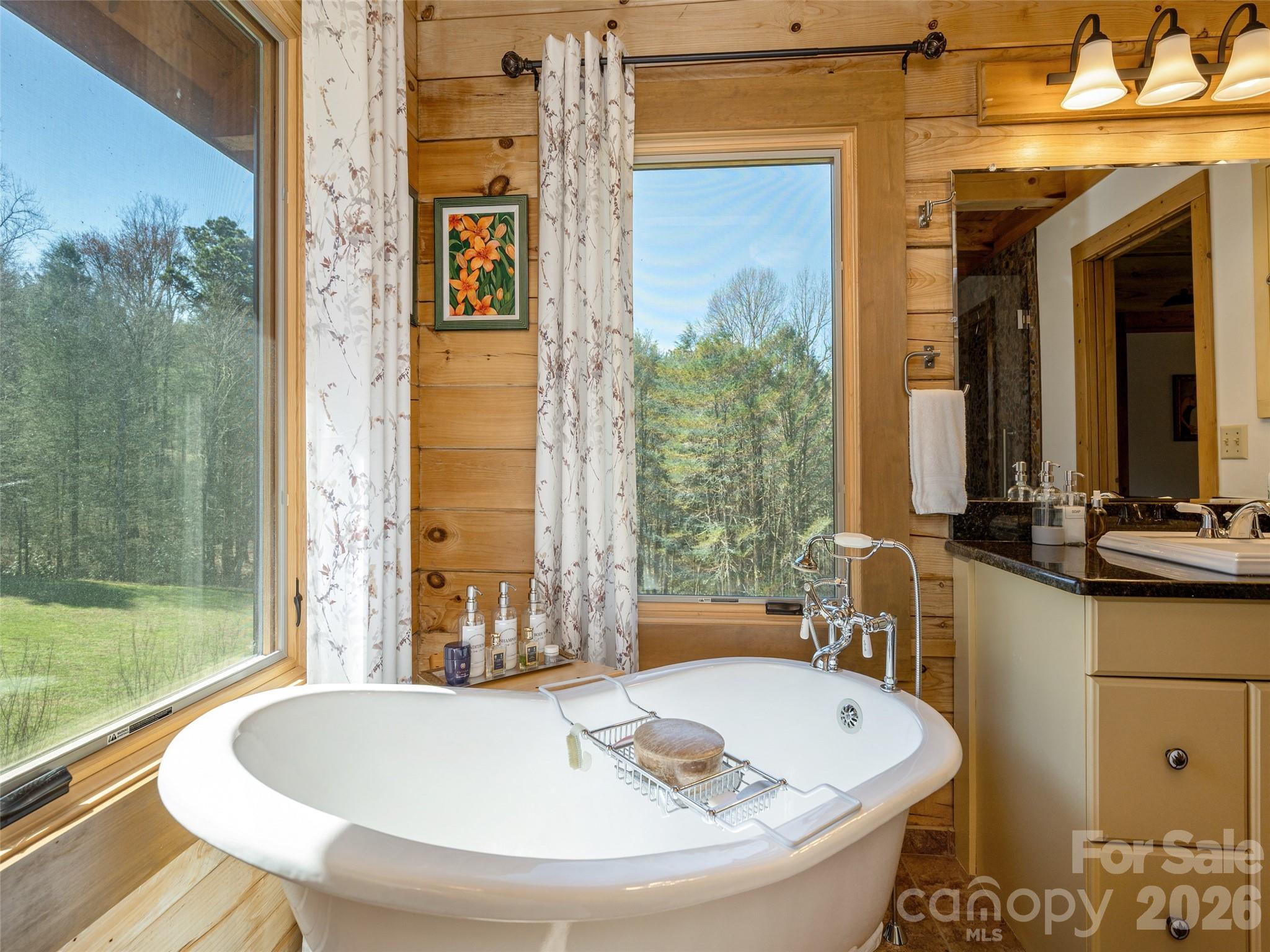 622 Oleta Road Hendersonville, NC 28792 - Photo 26 of 48 a bathroom with a tub and a sink