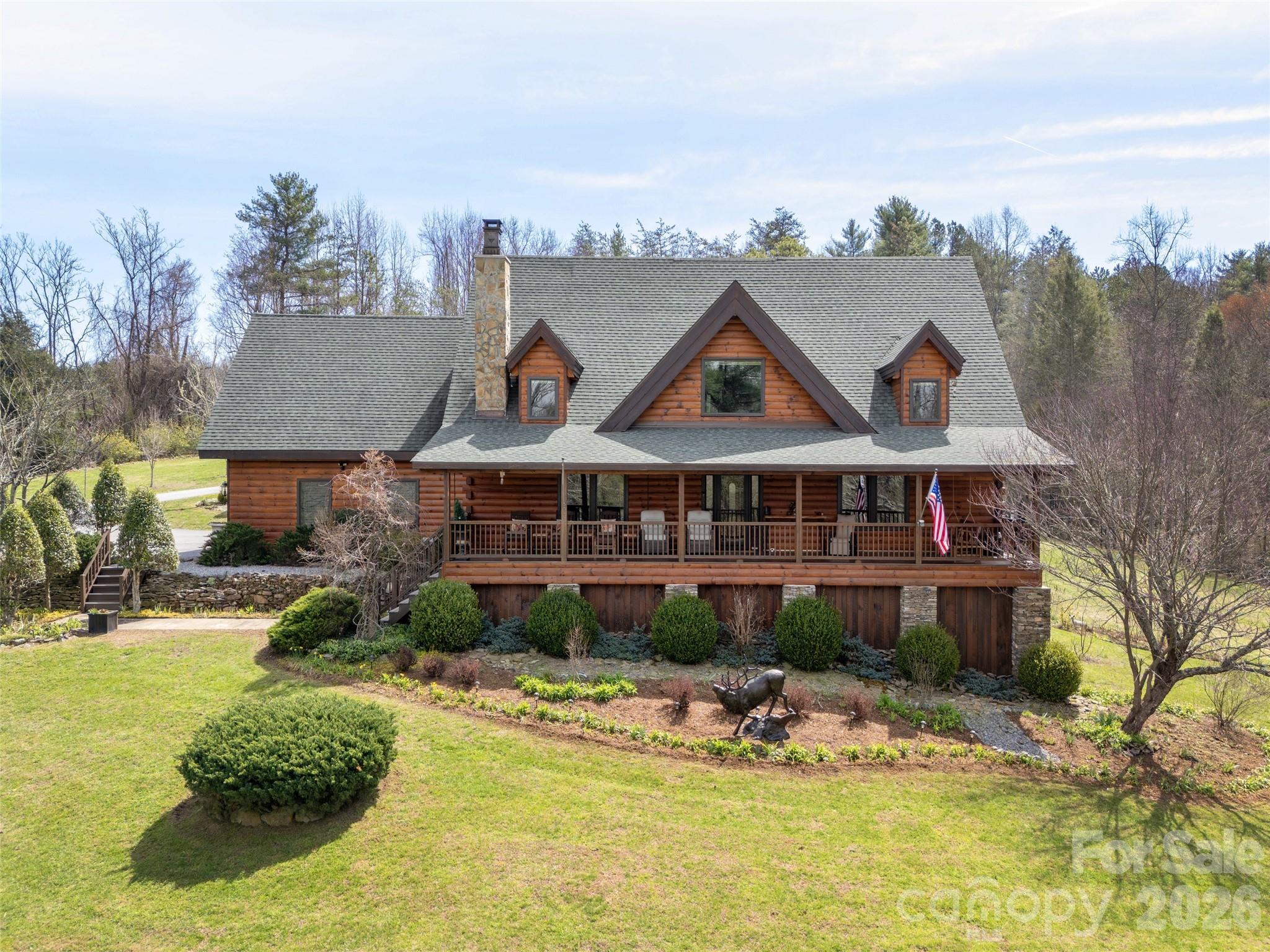 622 Oleta Road Hendersonville, NC 28792 - Photo 3 of 48 a view of a house with garden and trees in the background