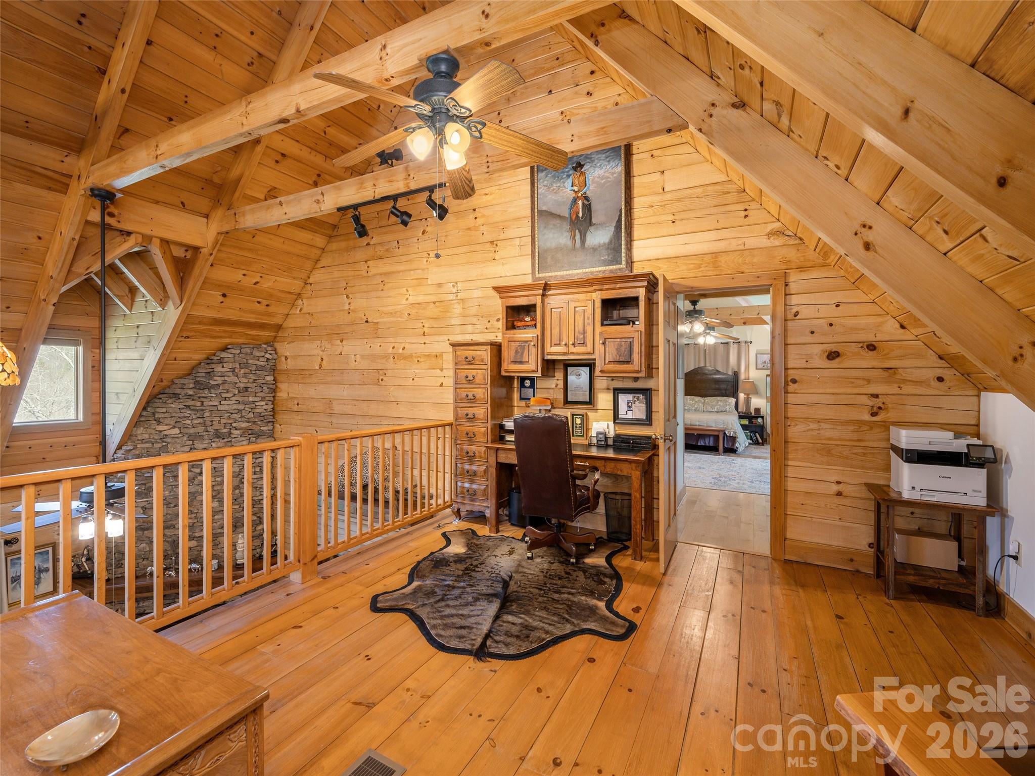 622 Oleta Road Hendersonville, NC 28792 - Photo 32 of 48 a view of a balcony with chairs and wooden floor