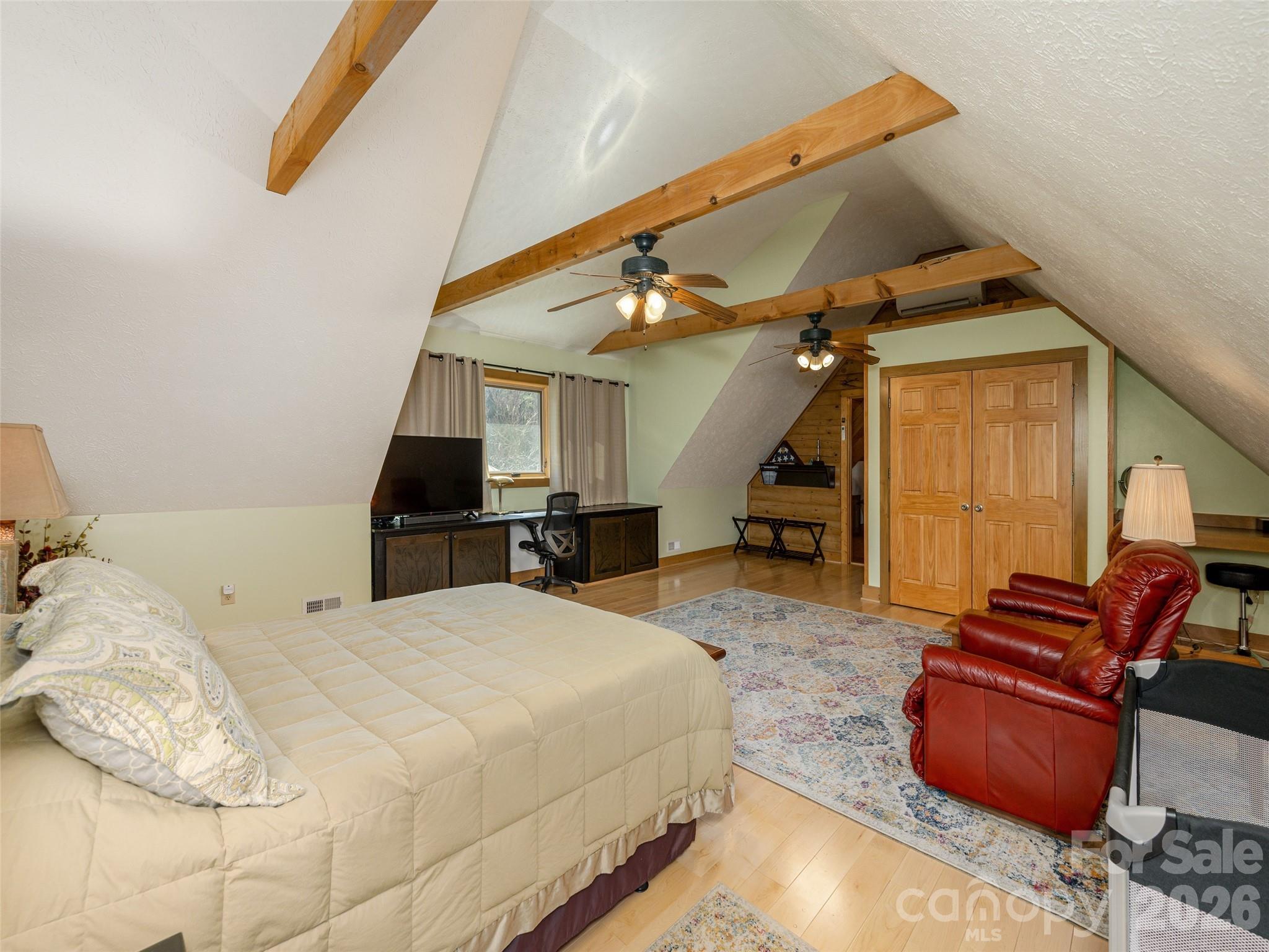 622 Oleta Road Hendersonville, NC 28792 - Photo 34 of 48 a bedroom with bed and window