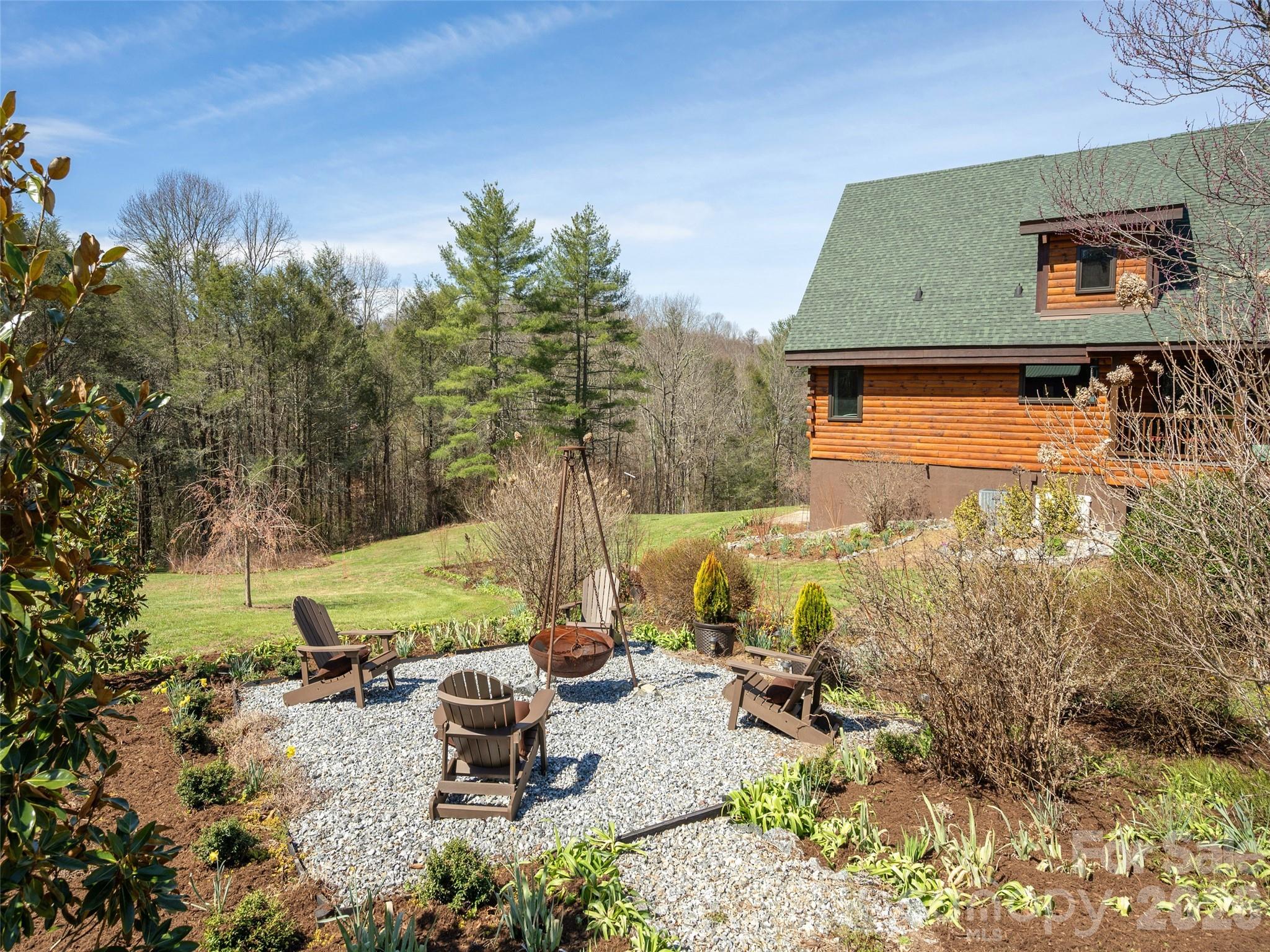 622 Oleta Road Hendersonville, NC 28792 - Photo 39 of 48 a view of a backyard with sitting area