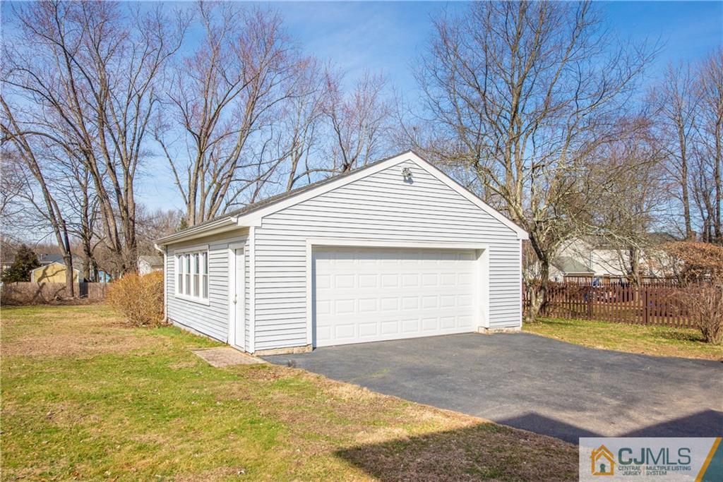 624 Ridge Road Monmouth Junction, NJ 08852 - Photo 13 of 15 a view of a house with a yard and garage
