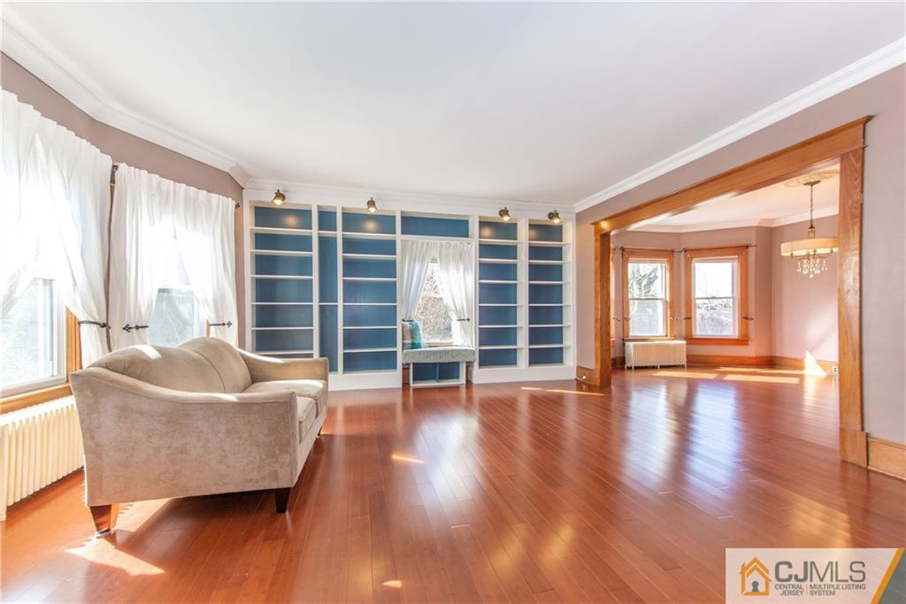 624 Ridge Road Monmouth Junction, NJ 08852 - Photo 4 of 15 a living room with furniture and a large window