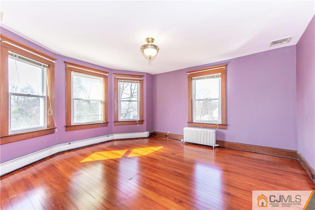 624 Ridge Road Monmouth Junction, NJ 08852 - Photo 7 of 15 a view of empty room with wooden floor and fan