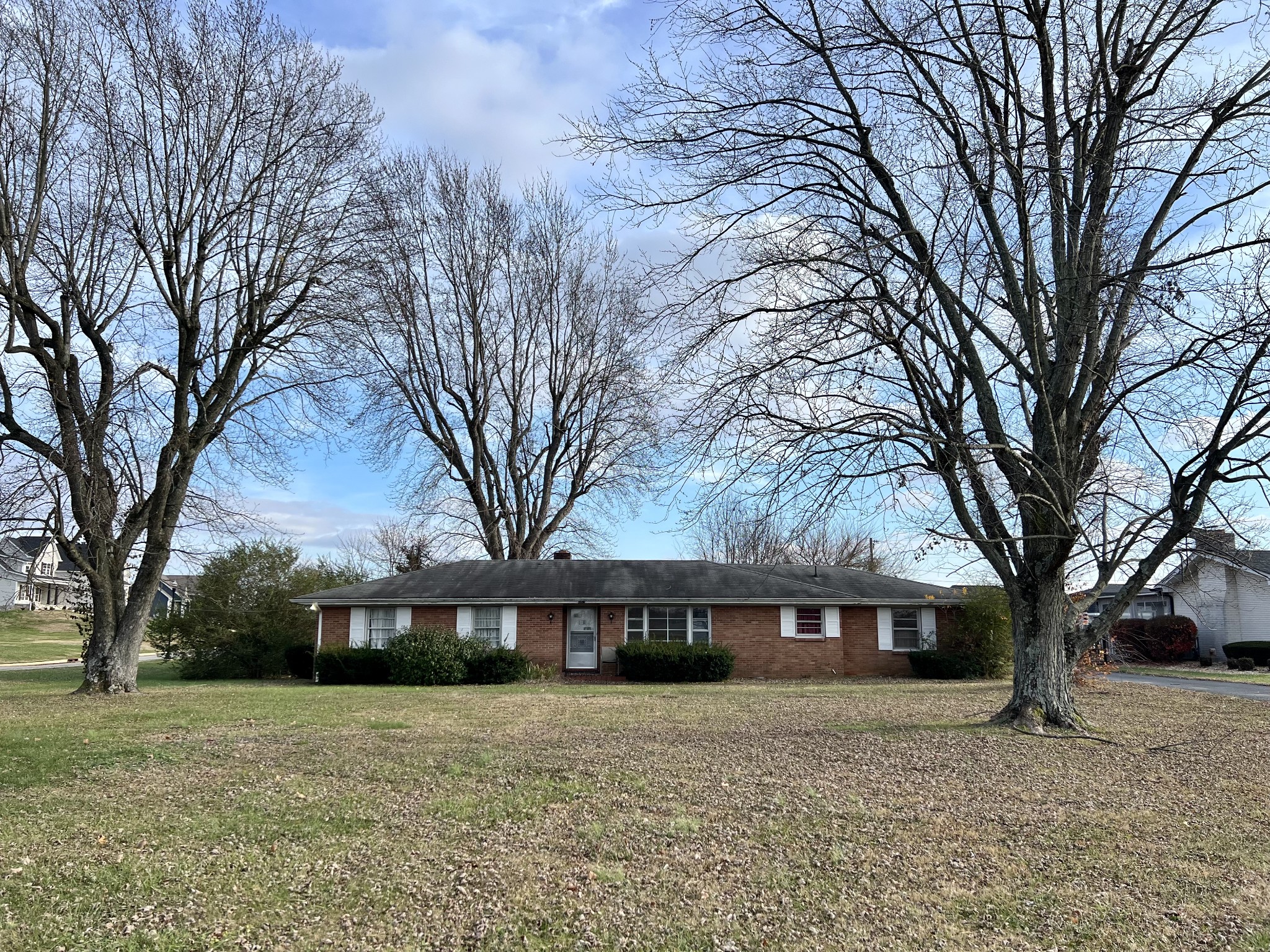 5057 Highway 49 Springfield, TN 37172 - Photo 2 of 5 a front view of a house with a yard and trees