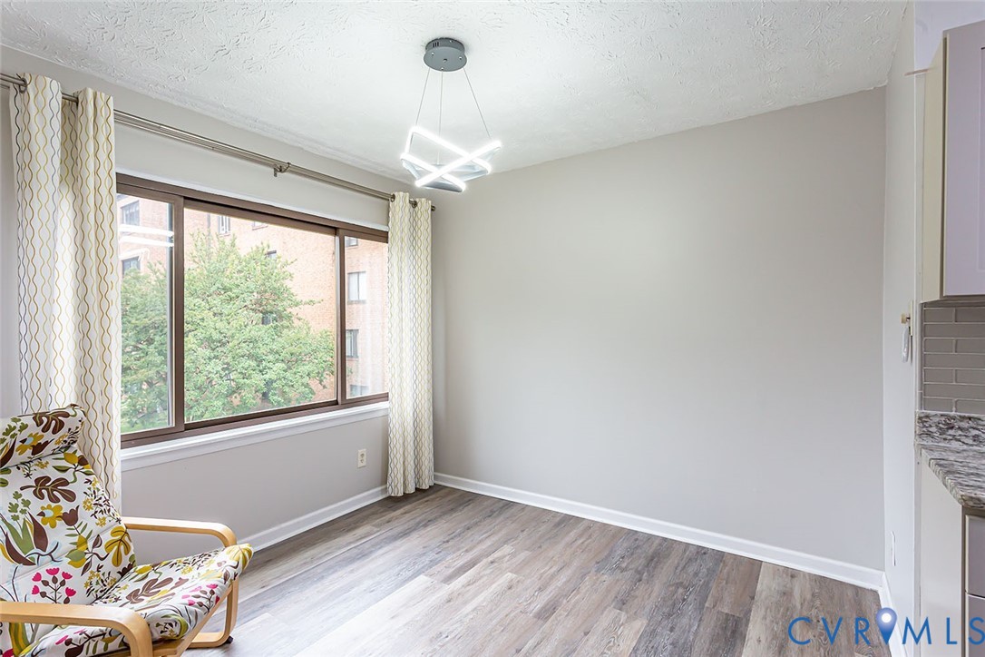 Sitting room featuring a textured ceiling and ligh