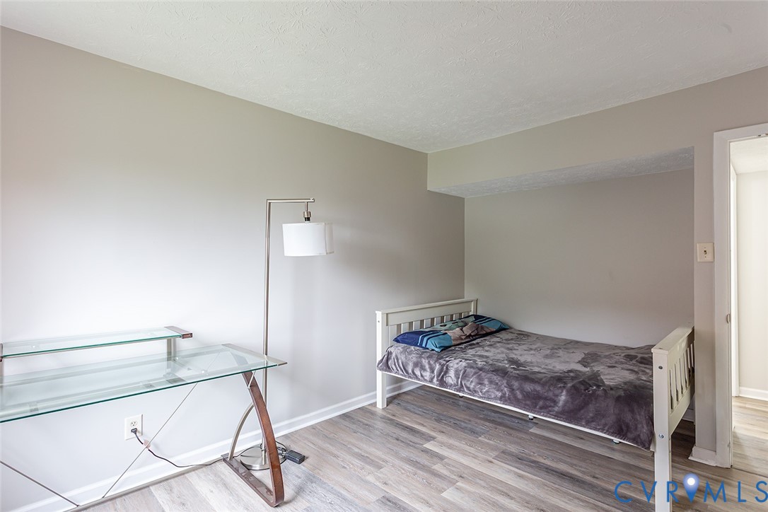 1500 Largo Road, Unit 201 Henrico, VA 23238 - Photo 18 of 26 Bedroom featuring light wood-style flooring and a