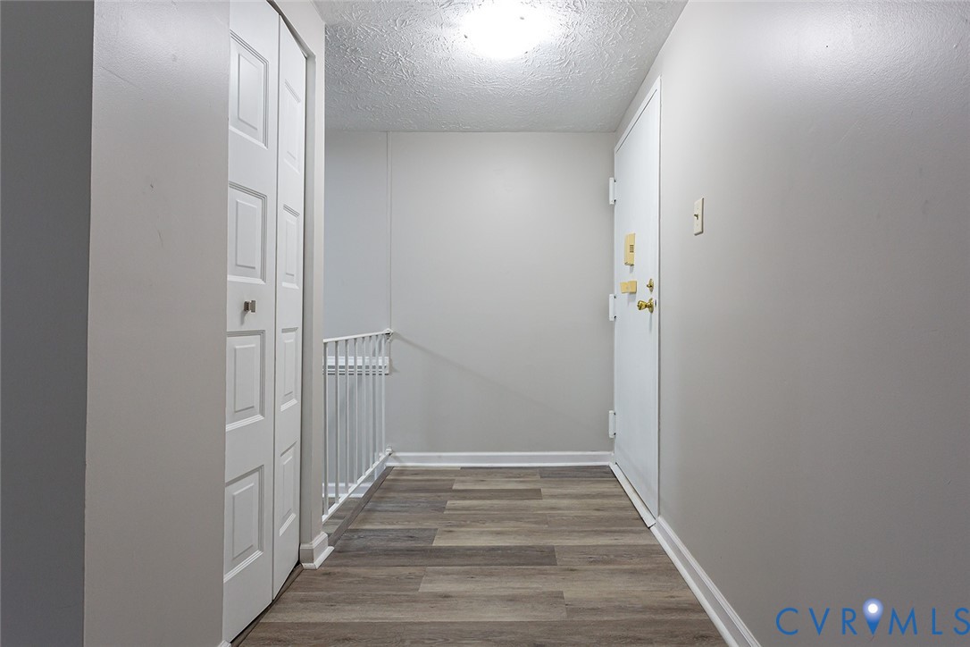 1500 Largo Road, Unit 201 Henrico, VA 23238 - Photo 4 of 26 Hall featuring light wood finished floors and a te