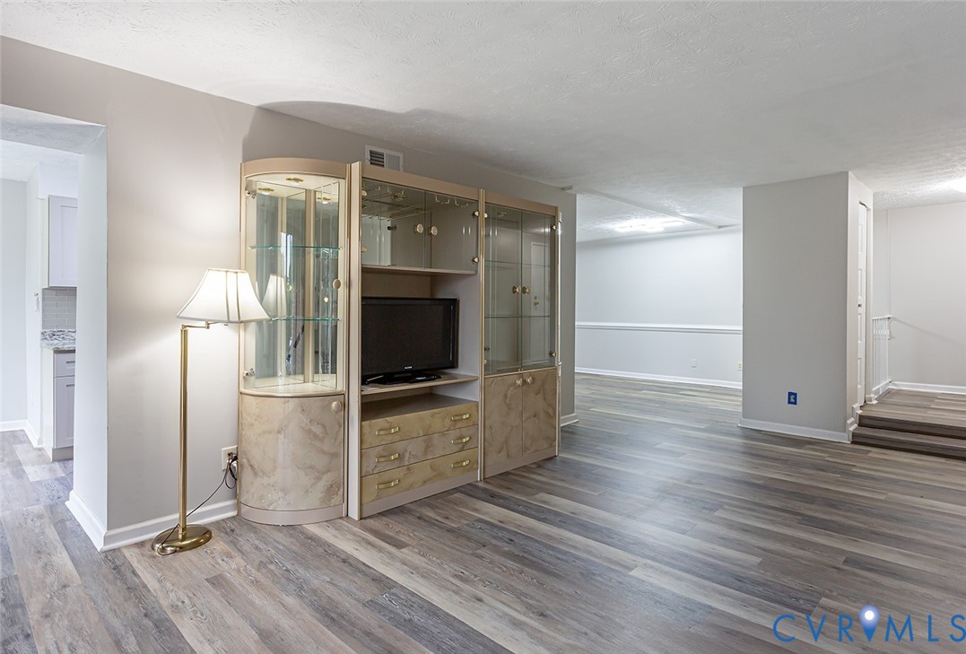 1500 Largo Road, Unit 201 Henrico, VA 23238 - Photo 7 of 26 Unfurnished living room featuring wood finished fl
