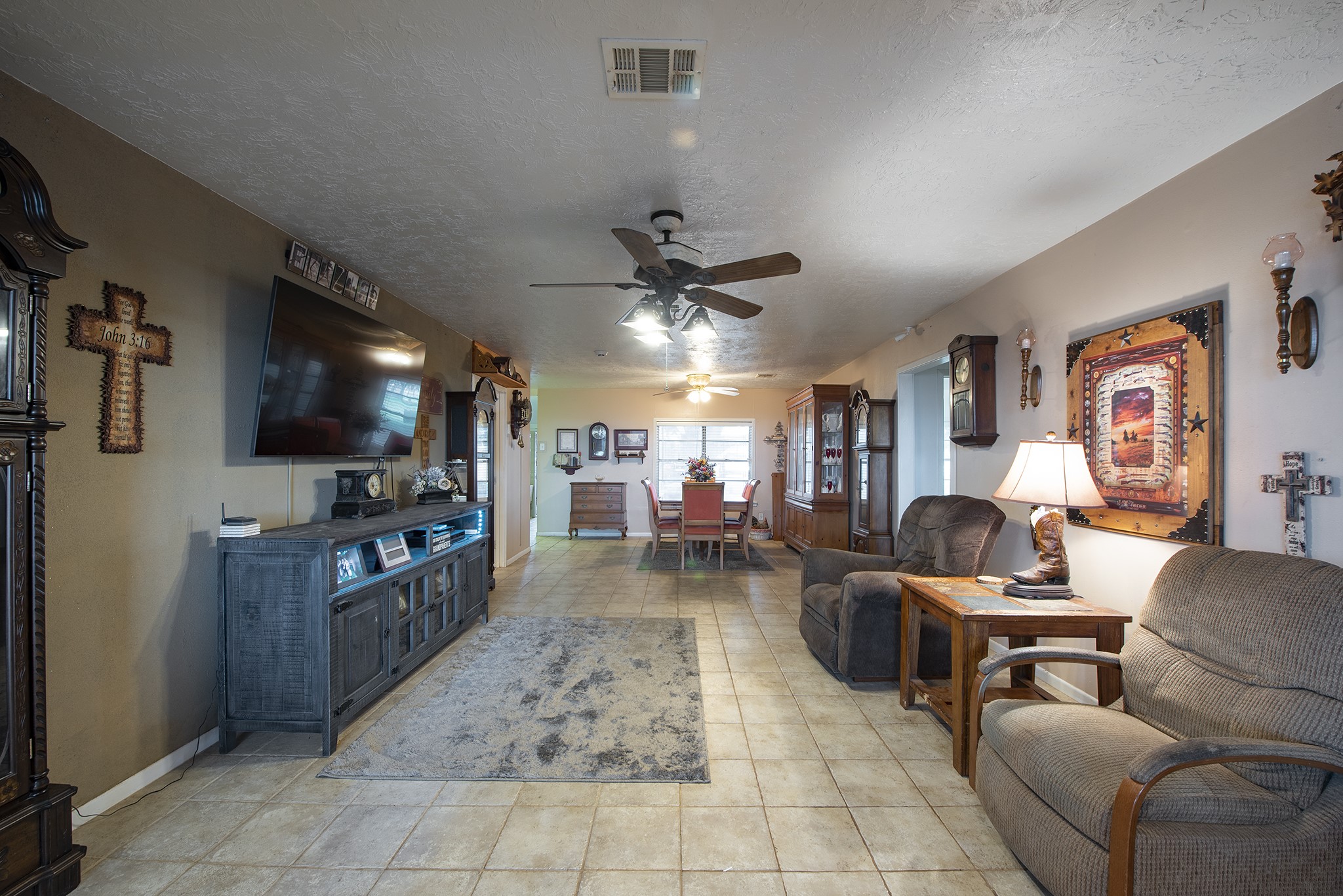 22234 Castle Road Waller, TX 77484 - Photo 18 of 50 a living room with furniture and a flat screen tv