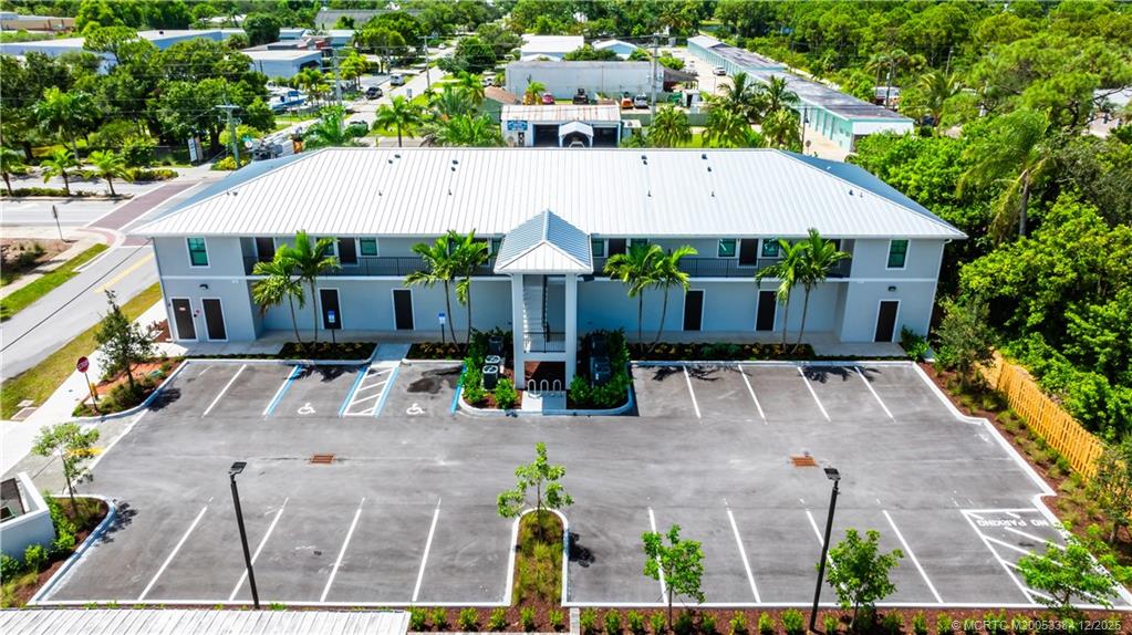 3375 Southwest Mapp Road, Unit 204 Palm City, FL 34990 - Photo 14 of 17 an aerial view of a house with yard and patio
