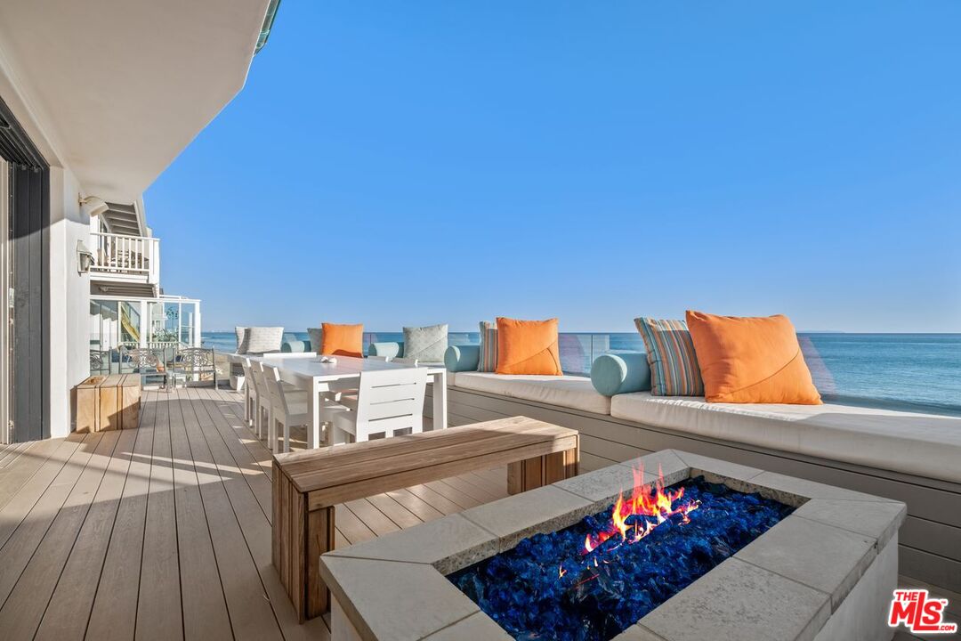 27212 Escondido Beach Road Malibu, CA 90265 - Photo 9 of 34 a view of a living room with furniture and a wooden floor