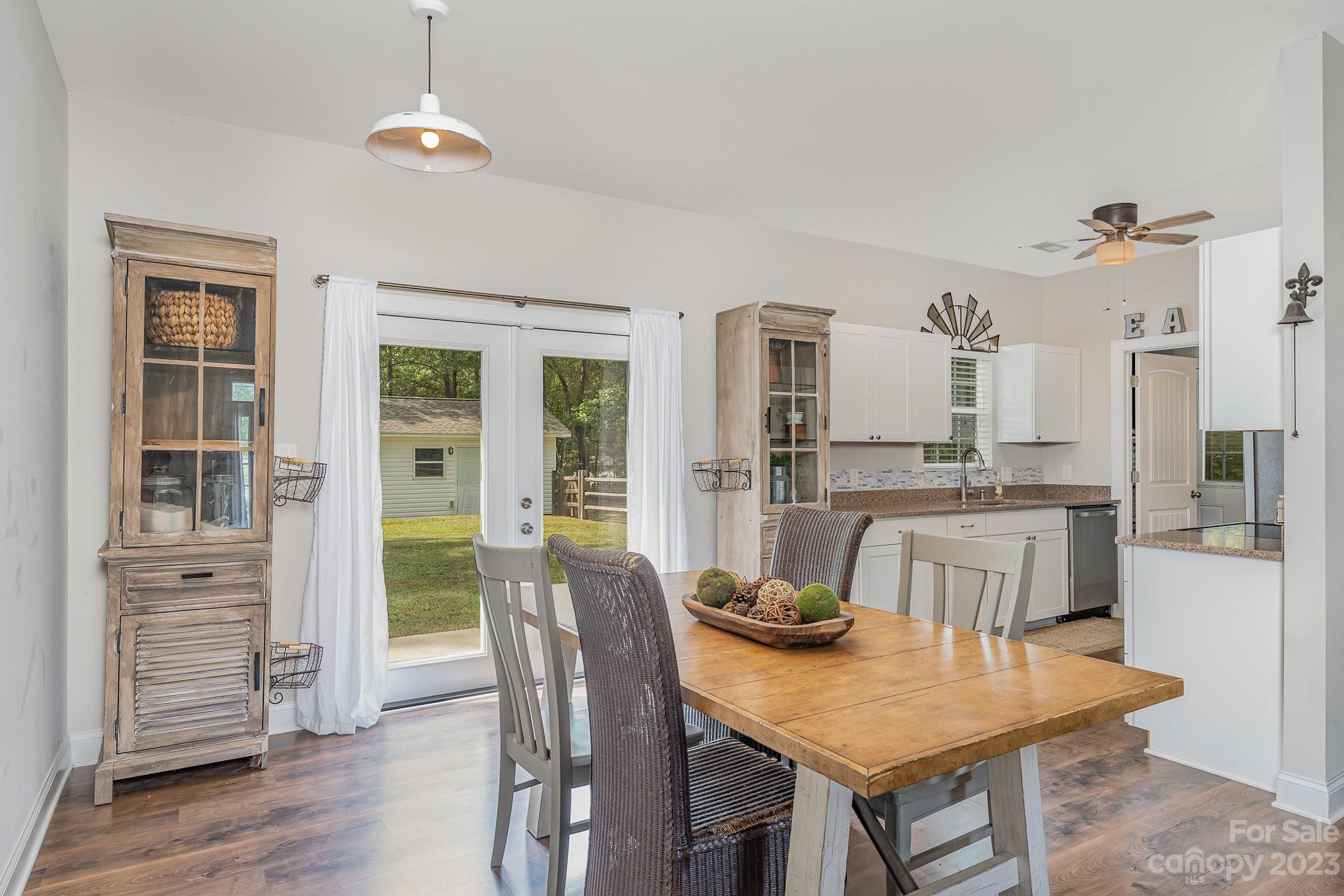 2906 Anderson Road South Catawba, SC 29704 - Photo 13 of 27 a dining room with furniture a chandelier and wooden floor