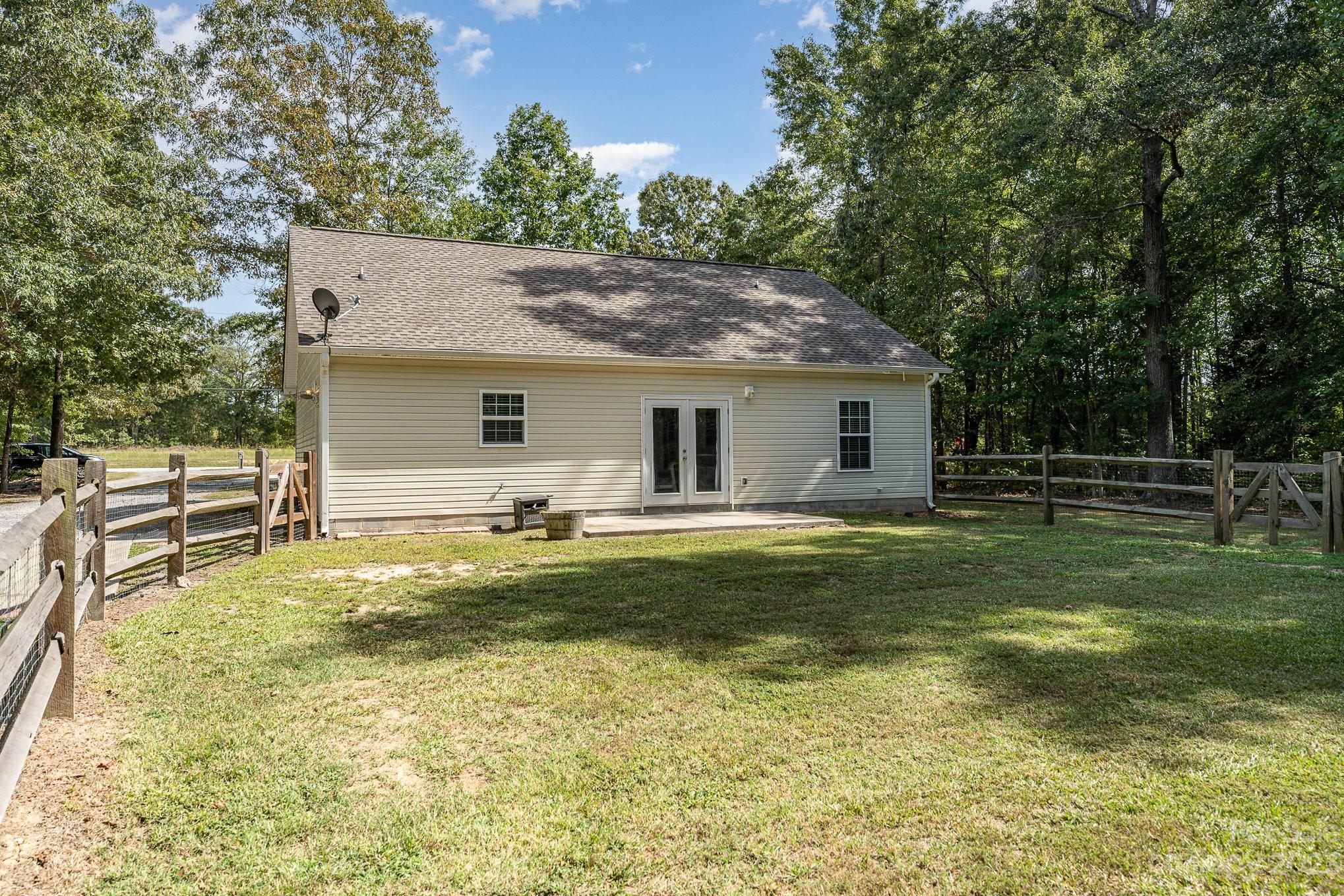 2906 Anderson Road South Catawba, SC 29704 - Photo 21 of 27 a backyard of a house with table and chairs