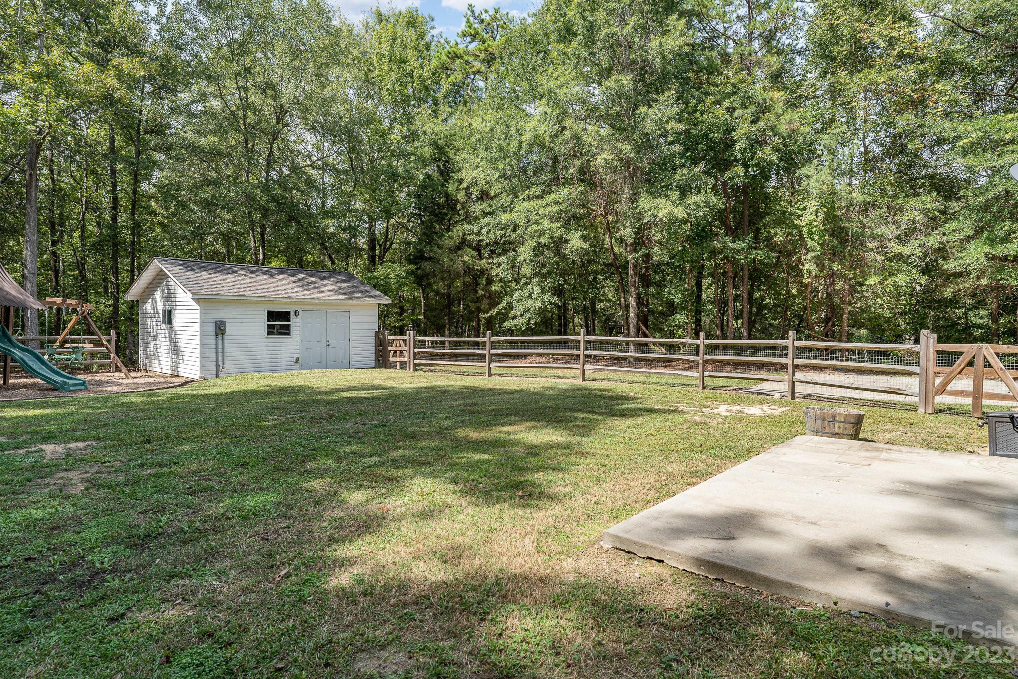 2906 Anderson Road South Catawba, SC 29704 - Photo 24 of 27 a view of a house with a backyard and a yard