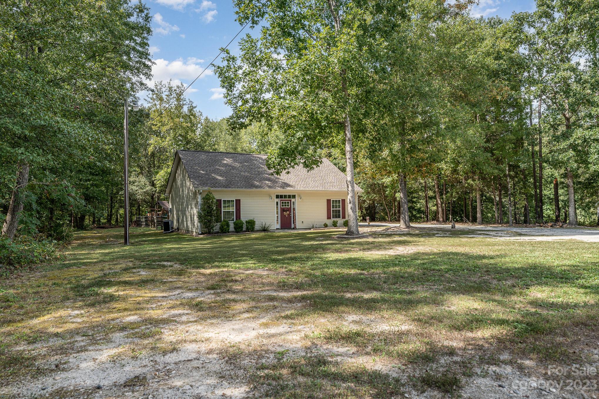 2906 Anderson Road South Catawba, SC 29704 - Photo 26 of 27 a front view of a house with a garden