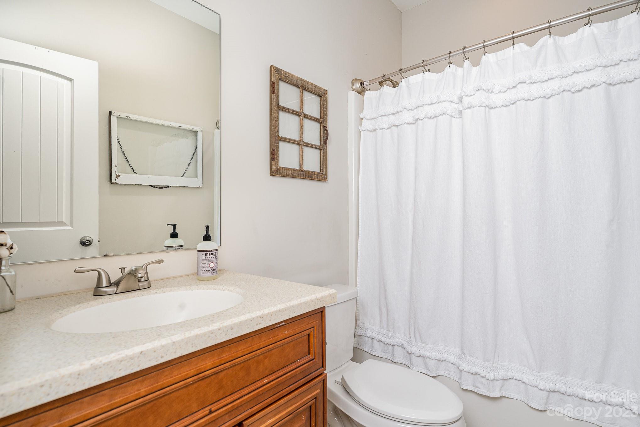 2906 Anderson Road South Catawba, SC 29704 - Photo 10 of 27 a bathroom with a granite countertop sink vanity mirror and toilet