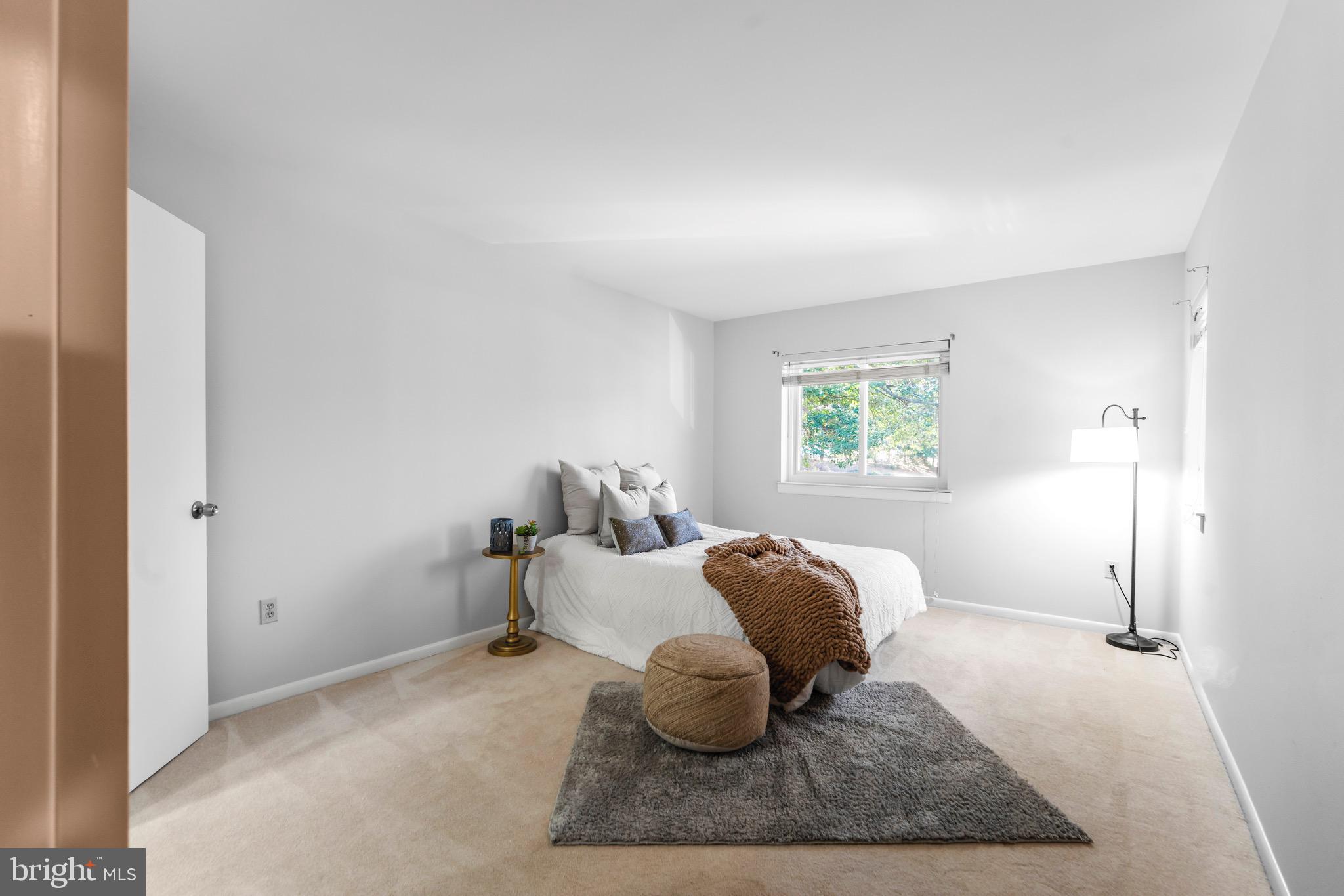 7512 Rolling Road Springfield, VA 22153 - Photo 12 of 32 a bedroom with a bed and window