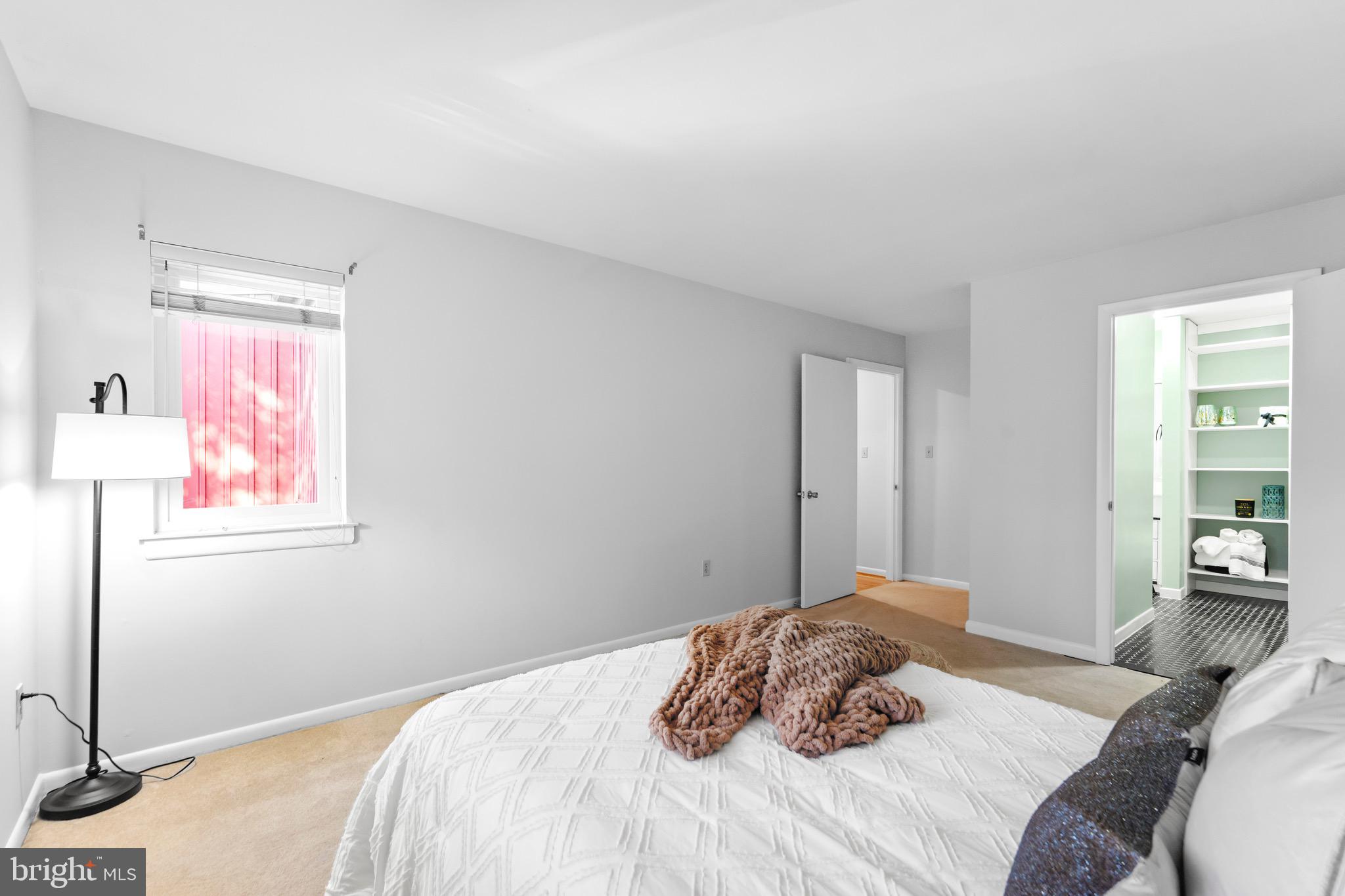 7512 Rolling Road Springfield, VA 22153 - Photo 14 of 32 a bedroom with a bed and a window