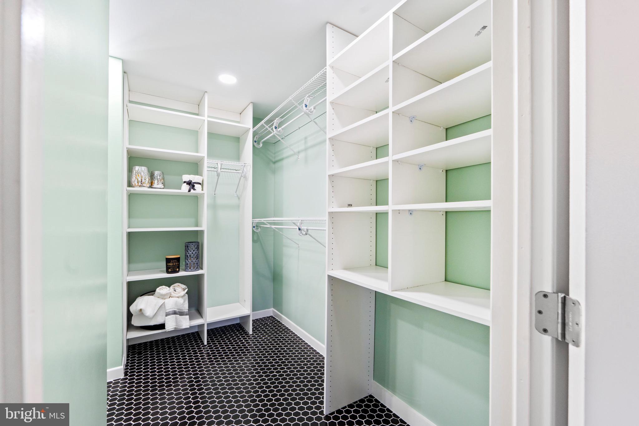 7512 Rolling Road Springfield, VA 22153 - Photo 15 of 32 a room with a walk in closet and wooden floor