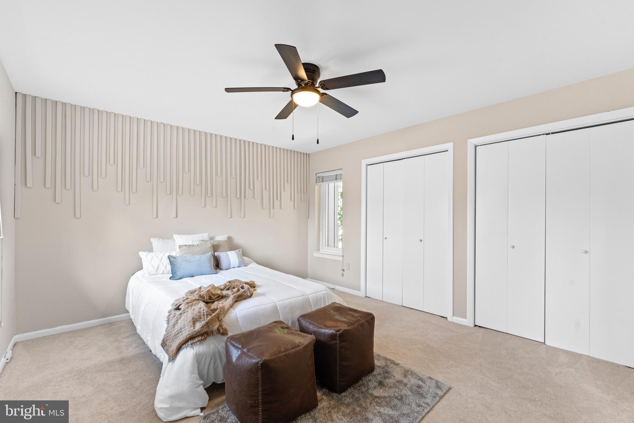 7512 Rolling Road Springfield, VA 22153 - Photo 19 of 32 a bedroom with a bed and a ceiling fan