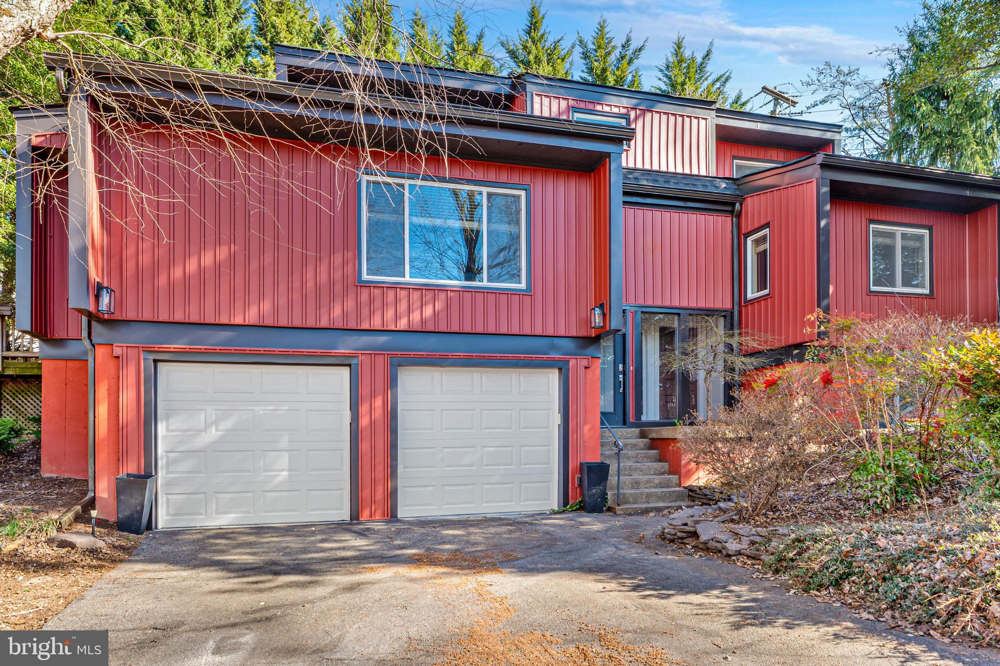 7512 Rolling Road Springfield, VA 22153 - Photo 2 of 32 a front view of a house with a yard
