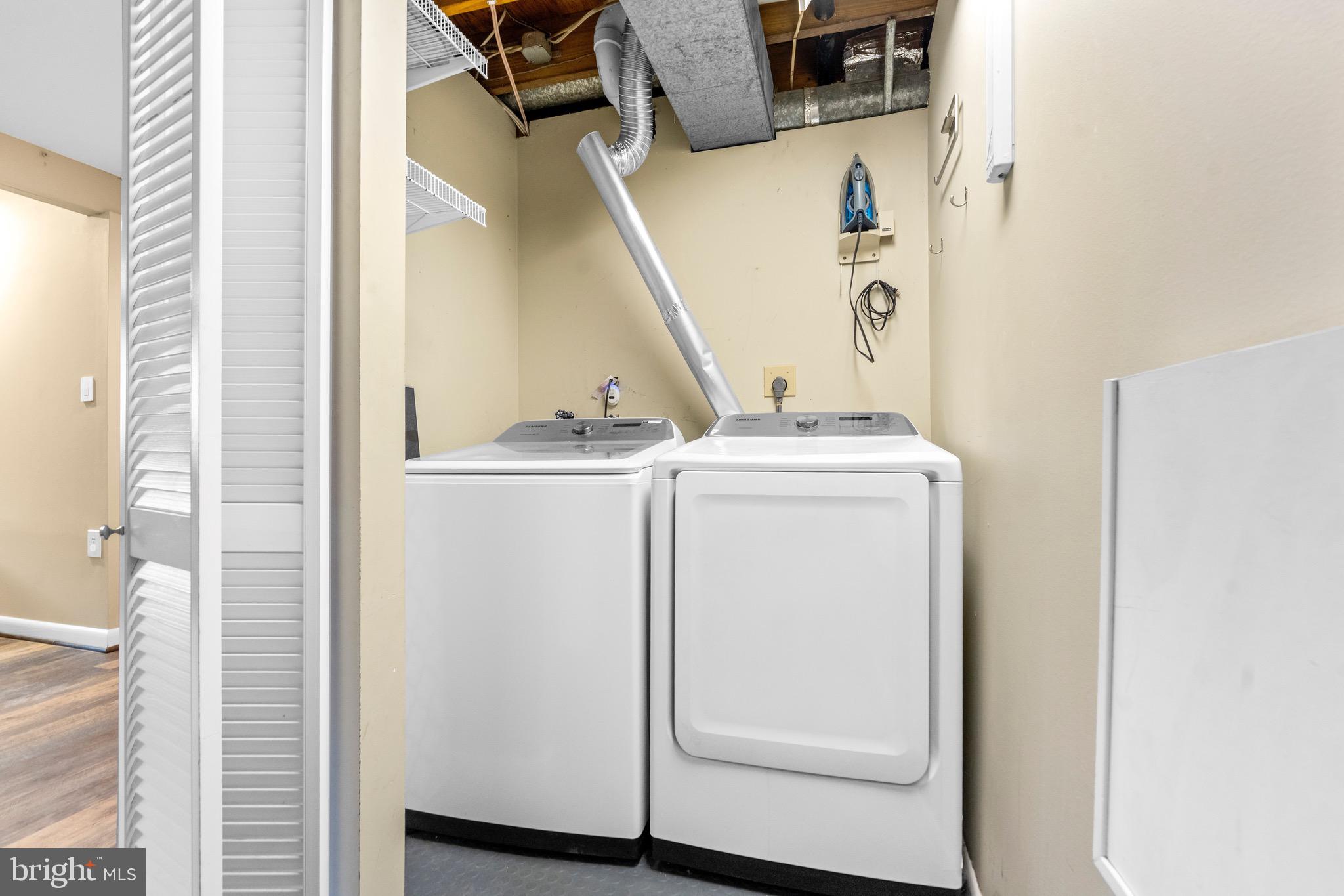 7512 Rolling Road Springfield, VA 22153 - Photo 27 of 32 a utility room with dryer and washer