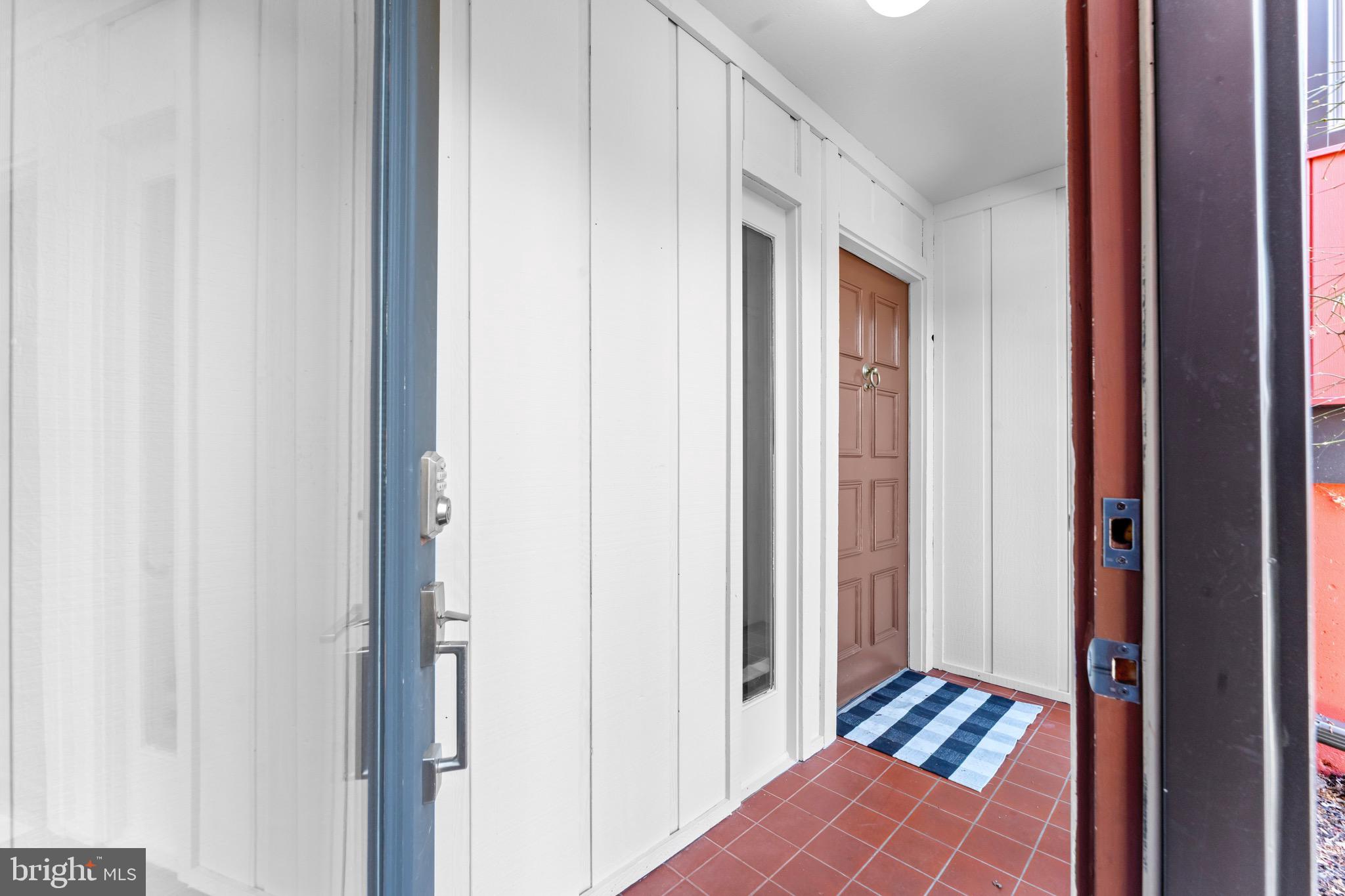 7512 Rolling Road Springfield, VA 22153 - Photo 3 of 32 a view of a bedroom from the hallway